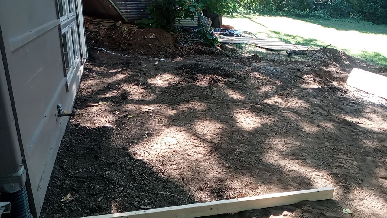 Back Yard Cantilivered Patio by LAND ESCAPES LLC