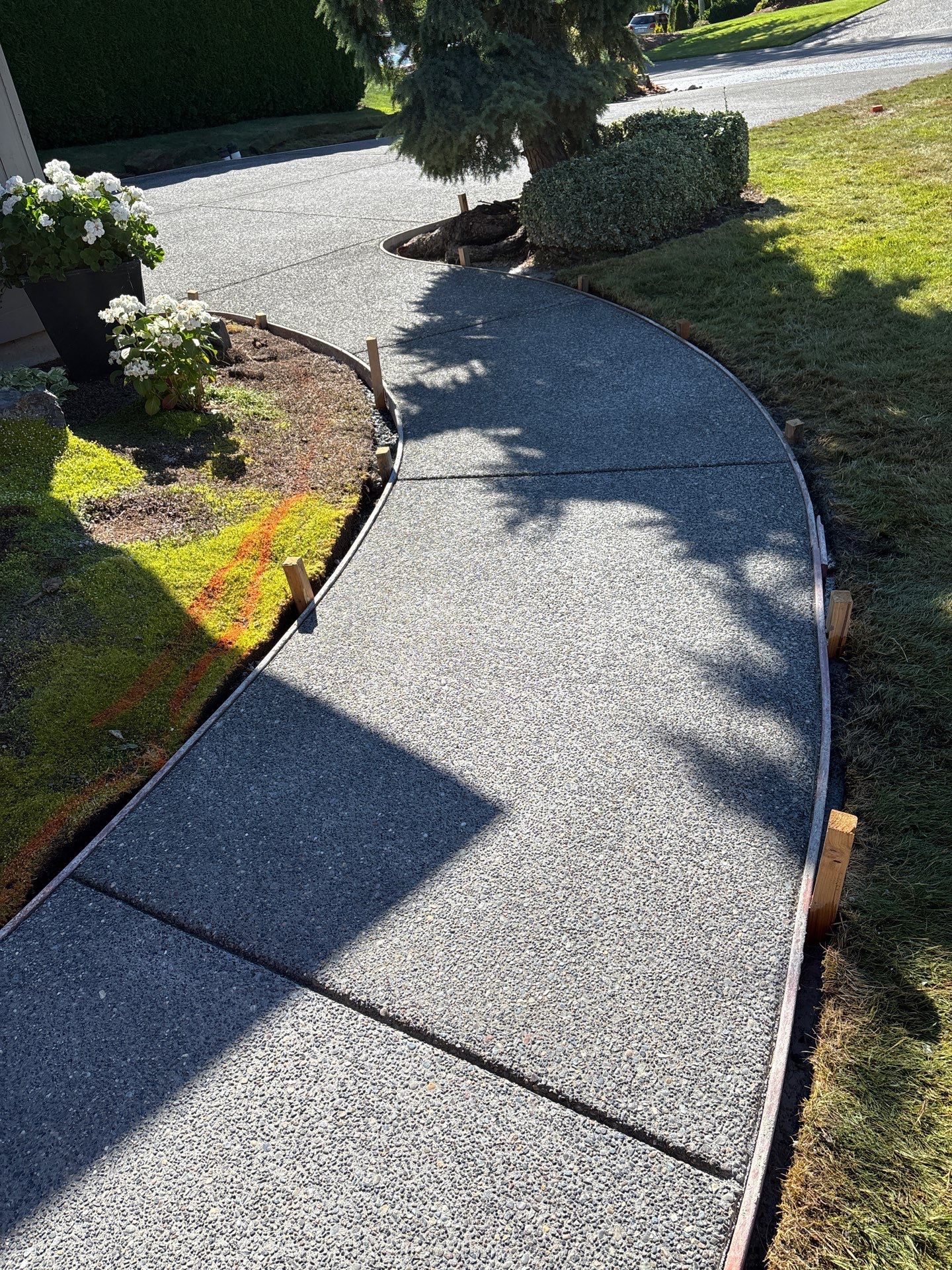 Exposed Aggregate Concrete Driveway Makeover  by Jireh Asphalt & Concrete Inc 