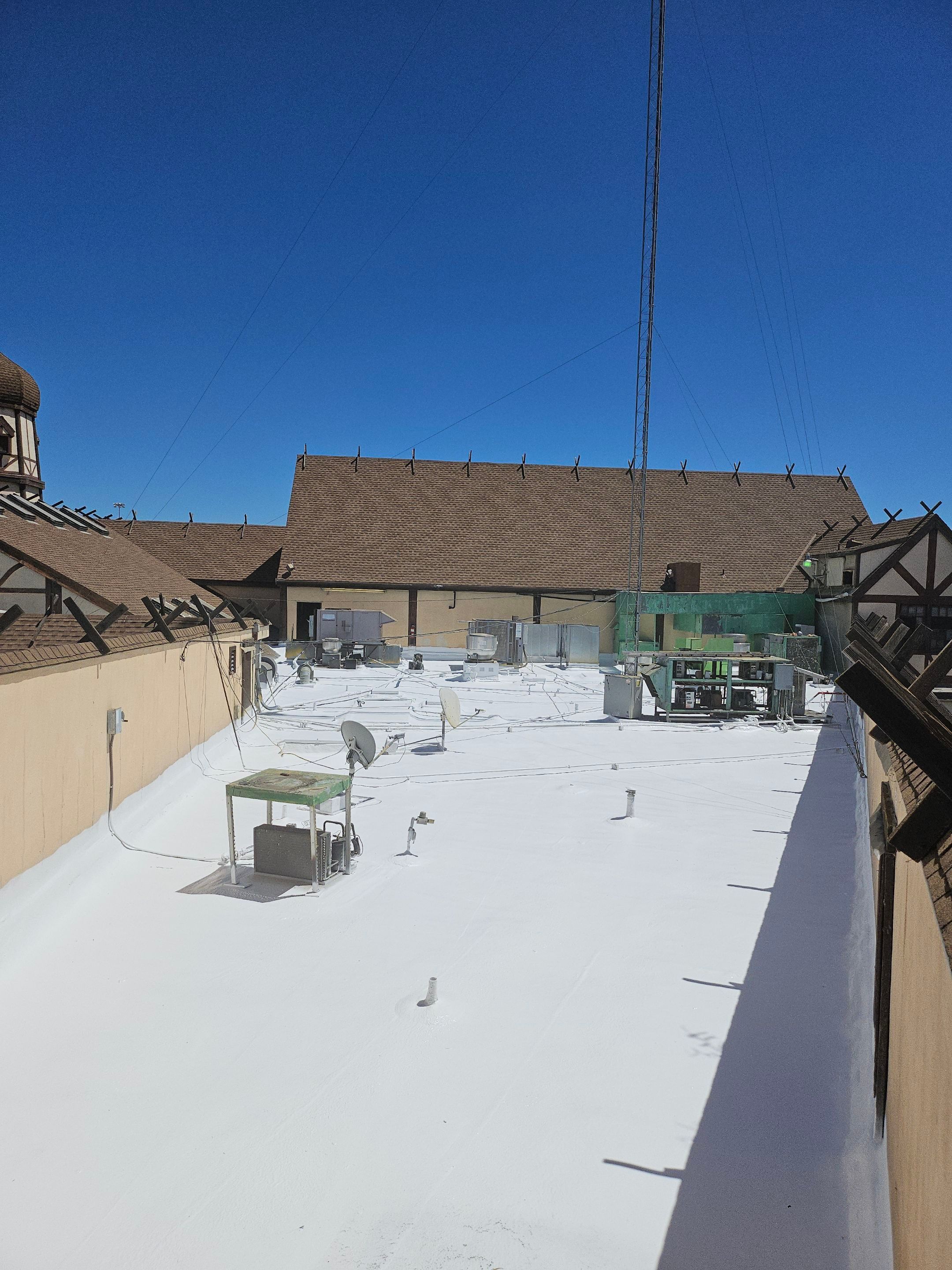 Spray foam and coatings using General Coatings acrylic coatings and spray foam by Straight Edge Roofing Inc