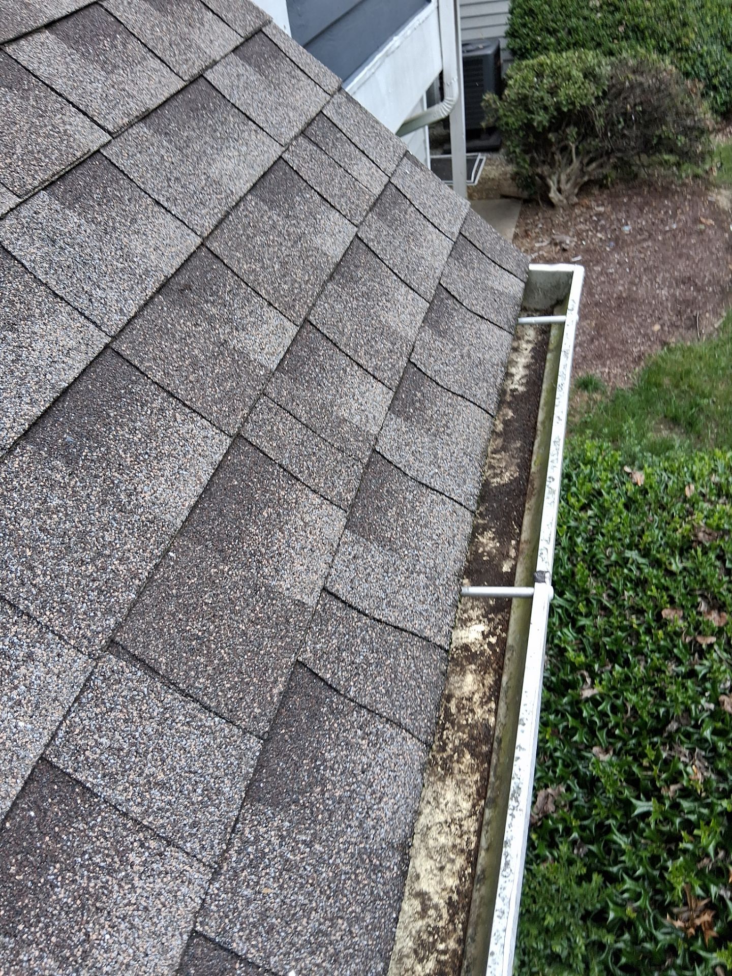 HOA gutter cleaning in Bowie & Largo, MD, after  photo showing full gutters.