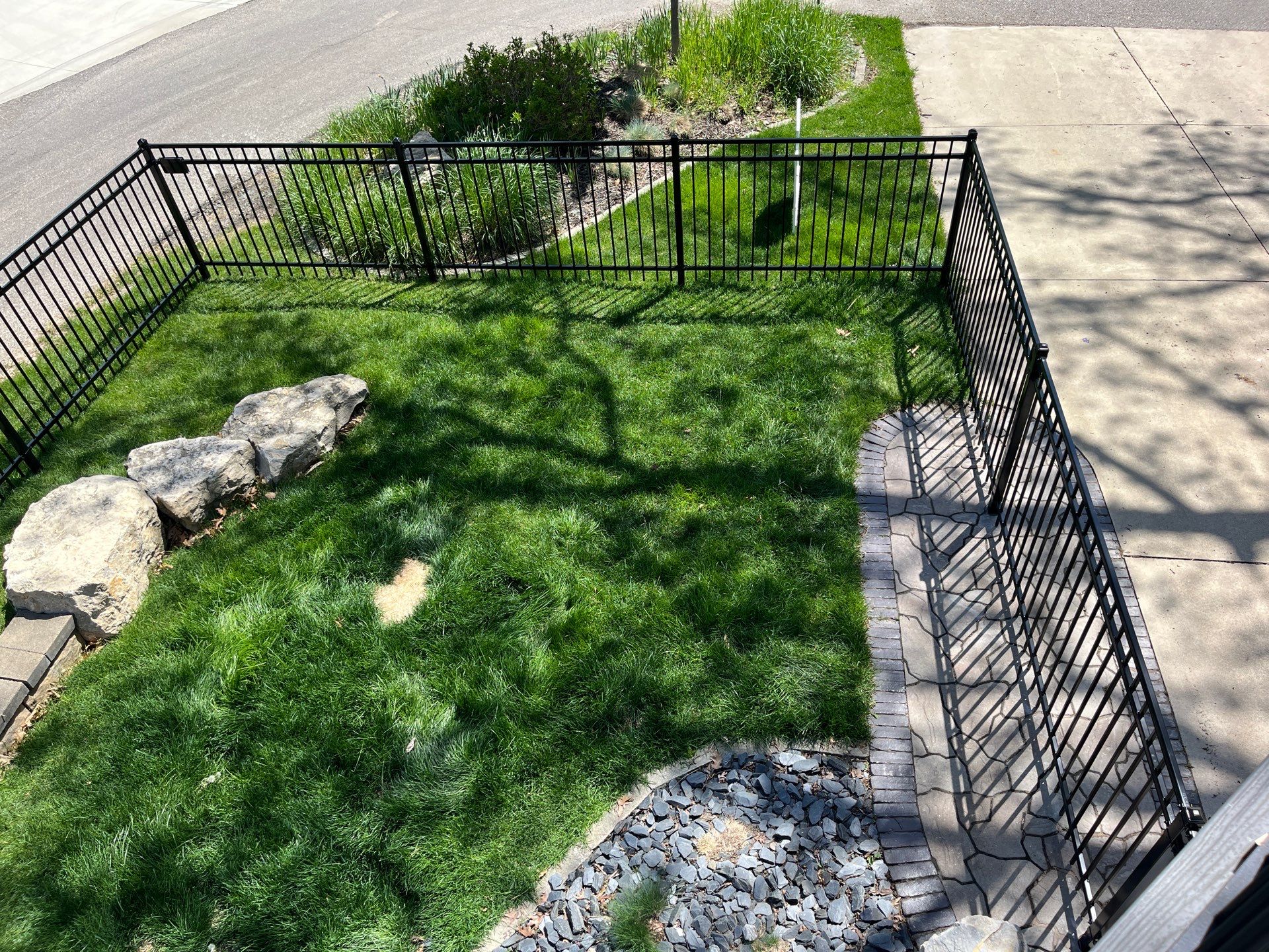 Ornamental Black Metal Picket Fence Installation in Cedar Falls by Perfect Picket Fence and Stain