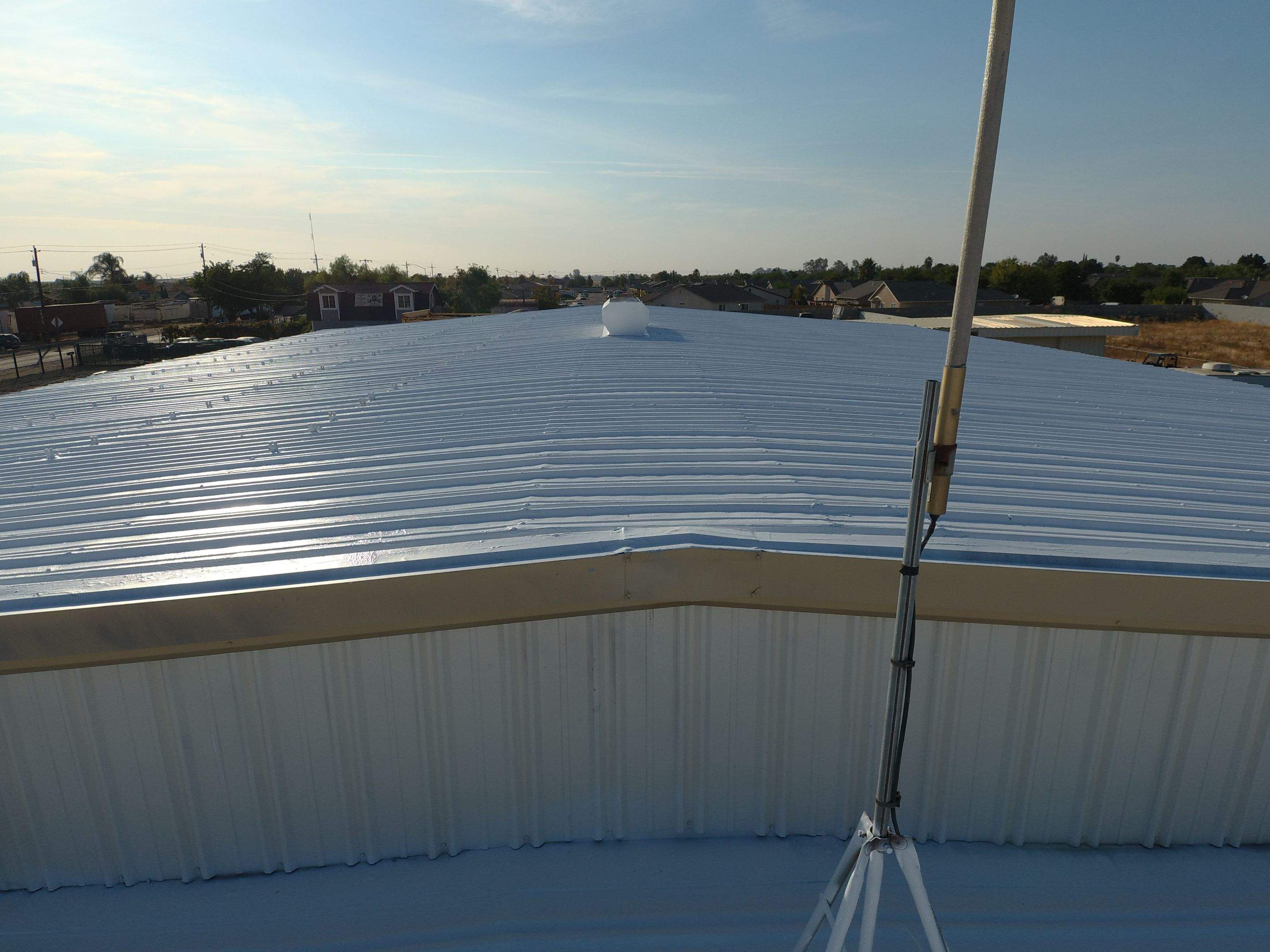 Metal Restoration Roofing system with Benchmark/PUMA XL 20 yr warranty by Straight Edge Roofing Inc