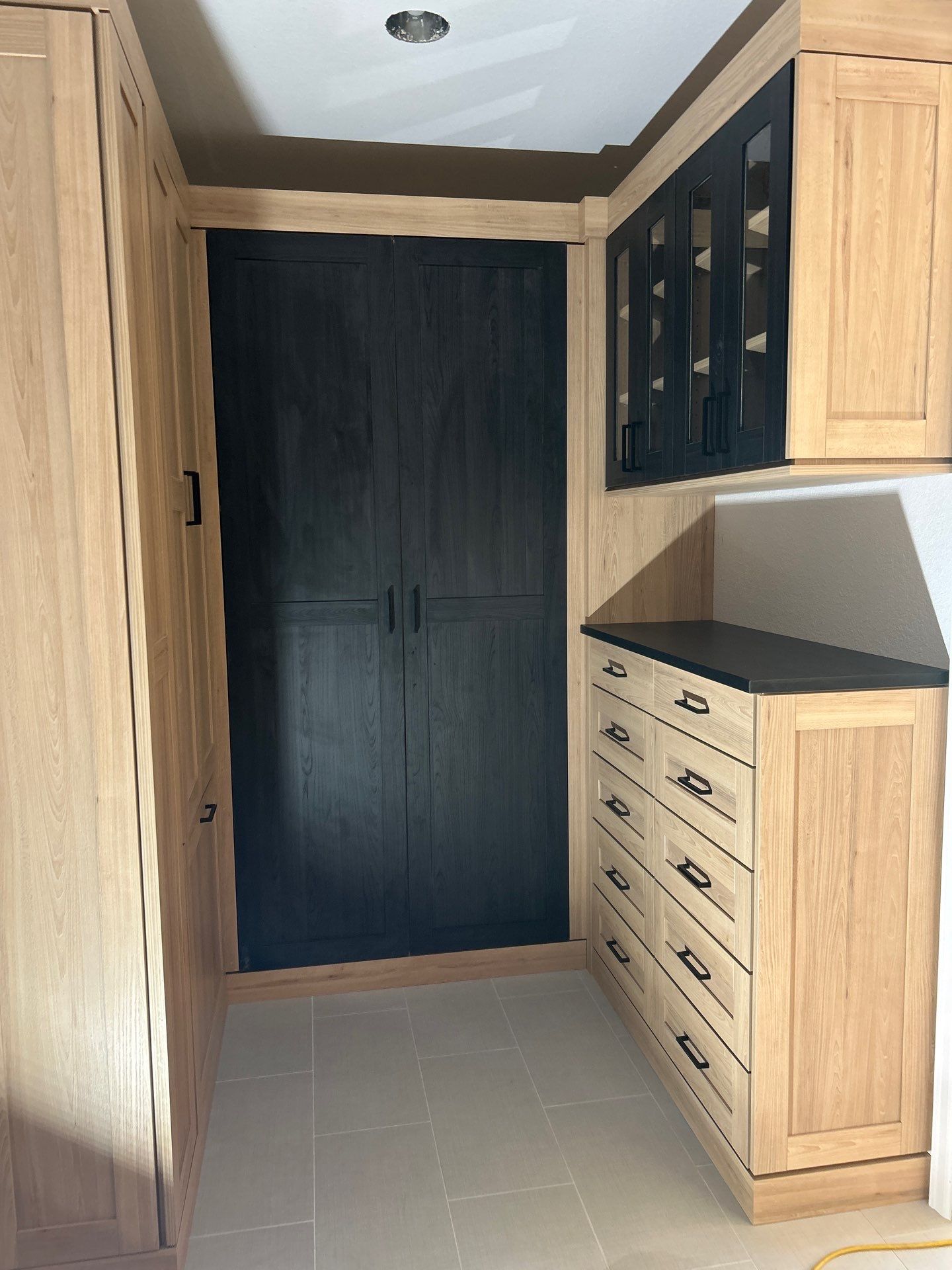 Two-Tone Closet with matching Mudroom + Laundry Room by Concept 32, Inc.
