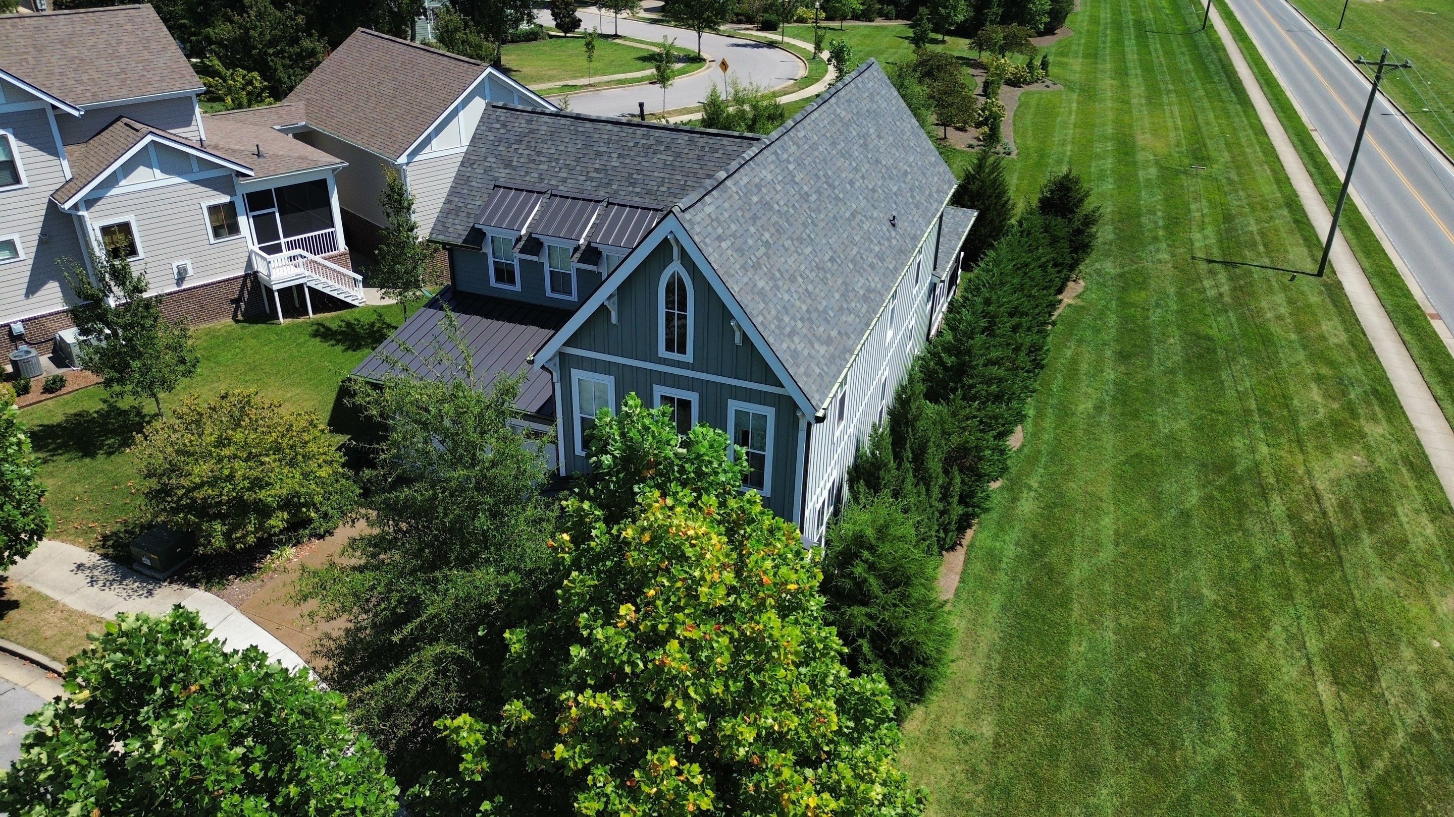 Residential Roof Replacement and Bronze Gutter Installation in Franklin by Shinglesmiths Roofing