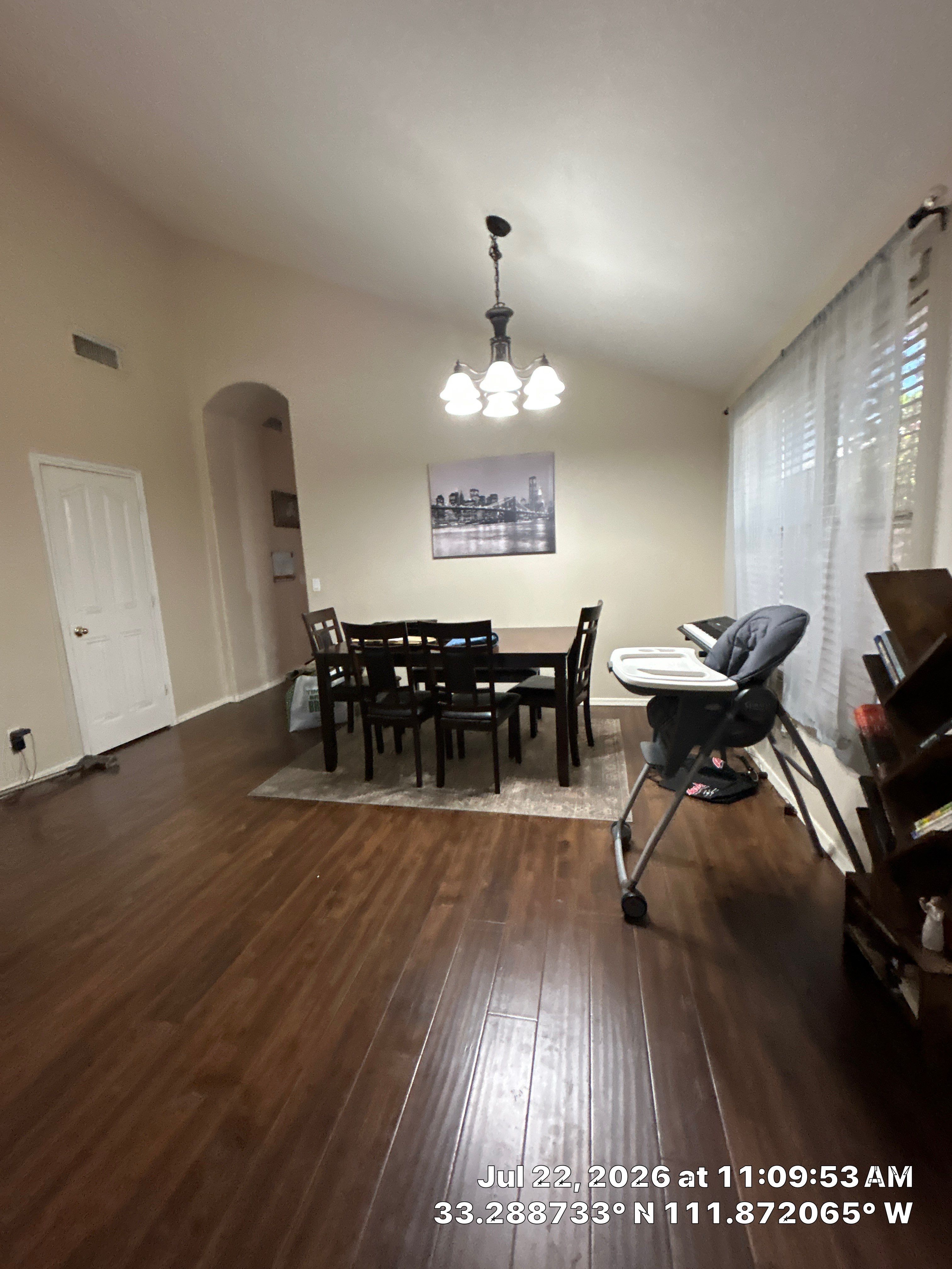 Chandler Dining Room Floor Remodel with Dark Wood-Look Laminate by CompanyCam Sales Demo