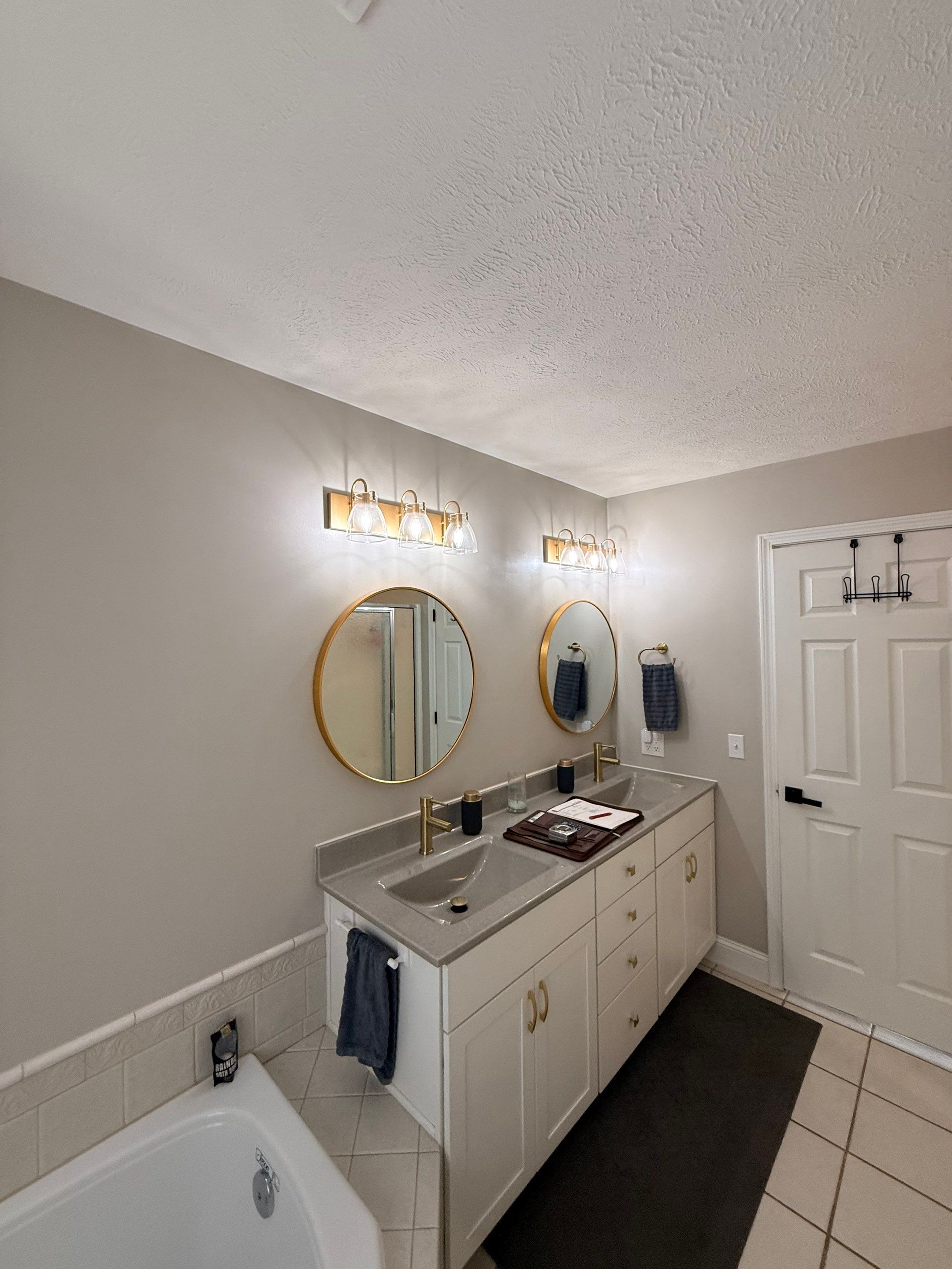Master Bathroom Renovation Featuring Dark Textured Shower Panels in Branson West by Kitchen Works LLC