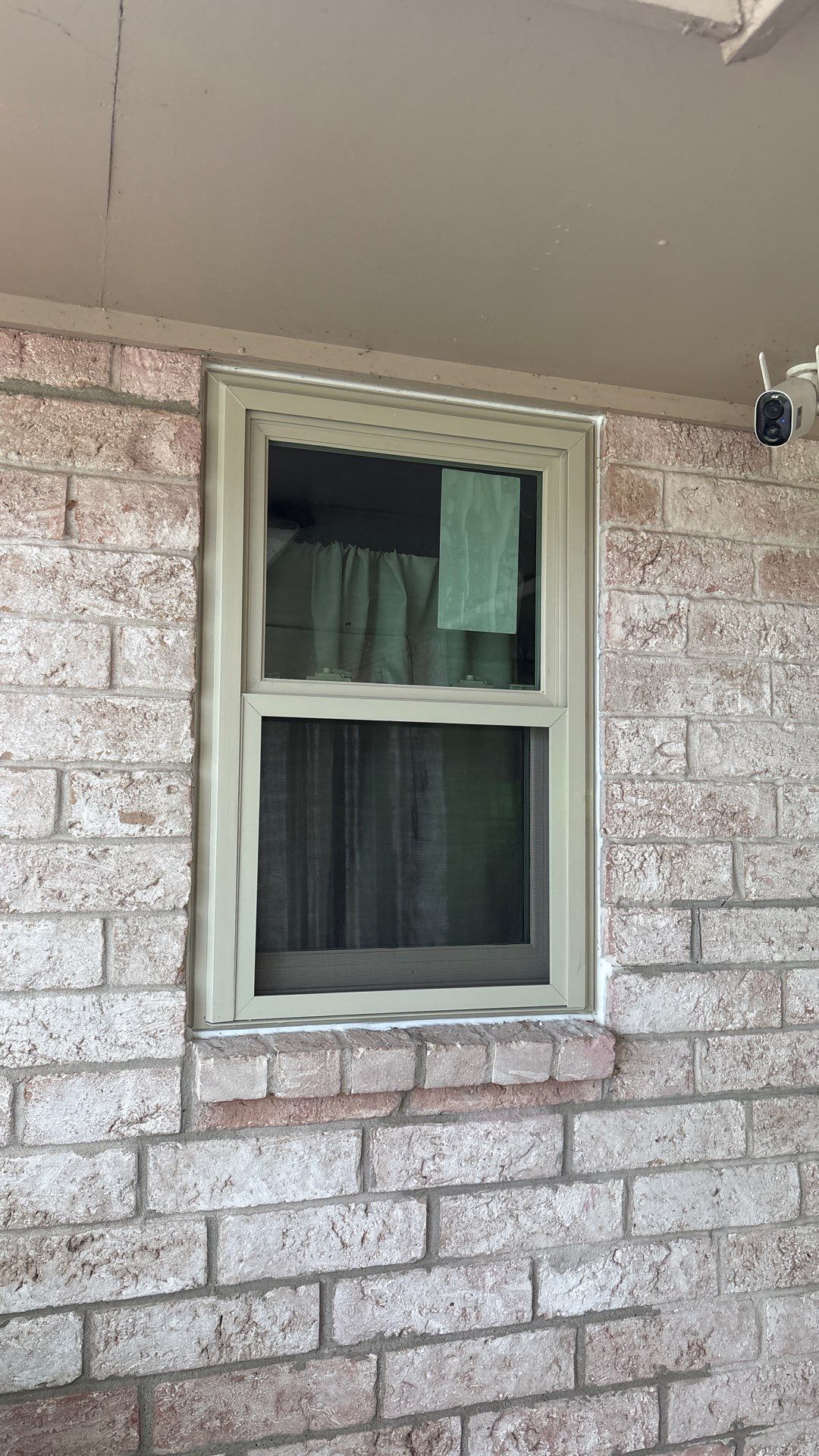 Colored Vinyl Windows to blend into brick by Bayfront Roofing and Construction