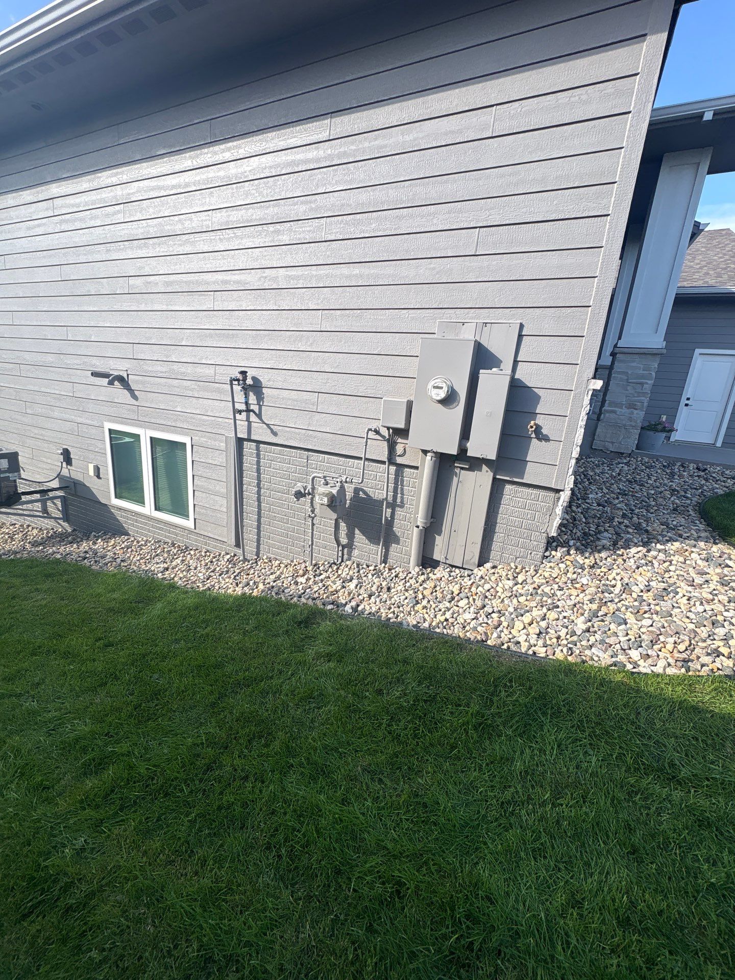 Gray Foundation Painting and Exterior Surface Refresh in Sioux Falls by Select Painting, Coatings & Garage Cabinets