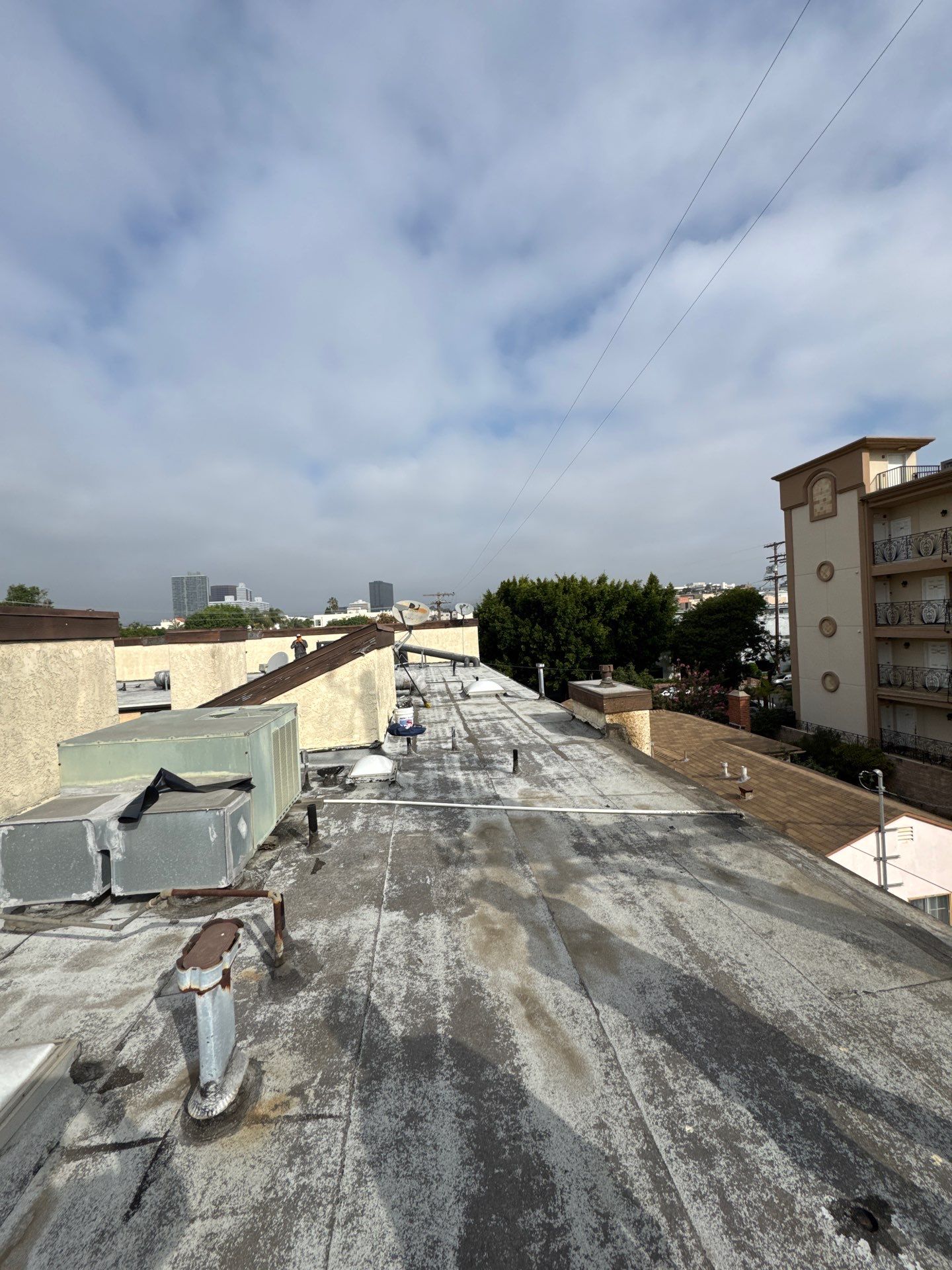 Apartment Building Silicone Coating by Hull Brothers Roofing