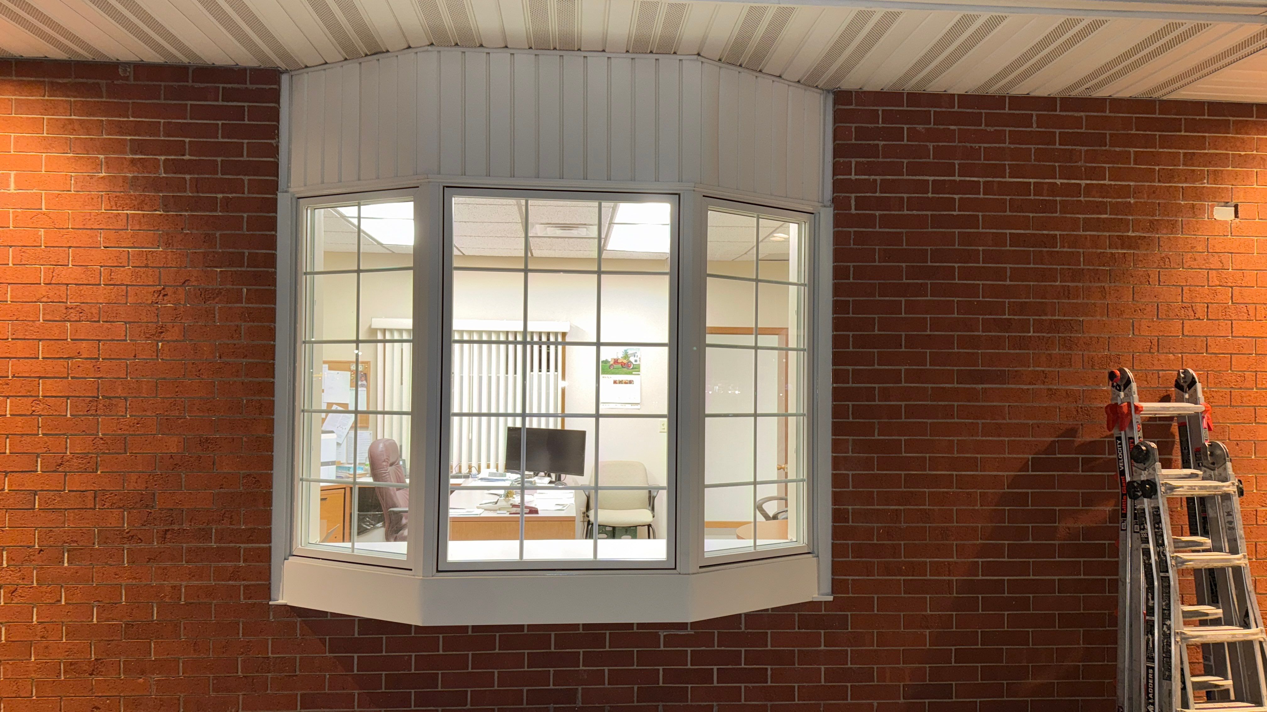 Pella Window installation using Pella Lifestyle wood/Aluminum window by United Windows and Siding LLC