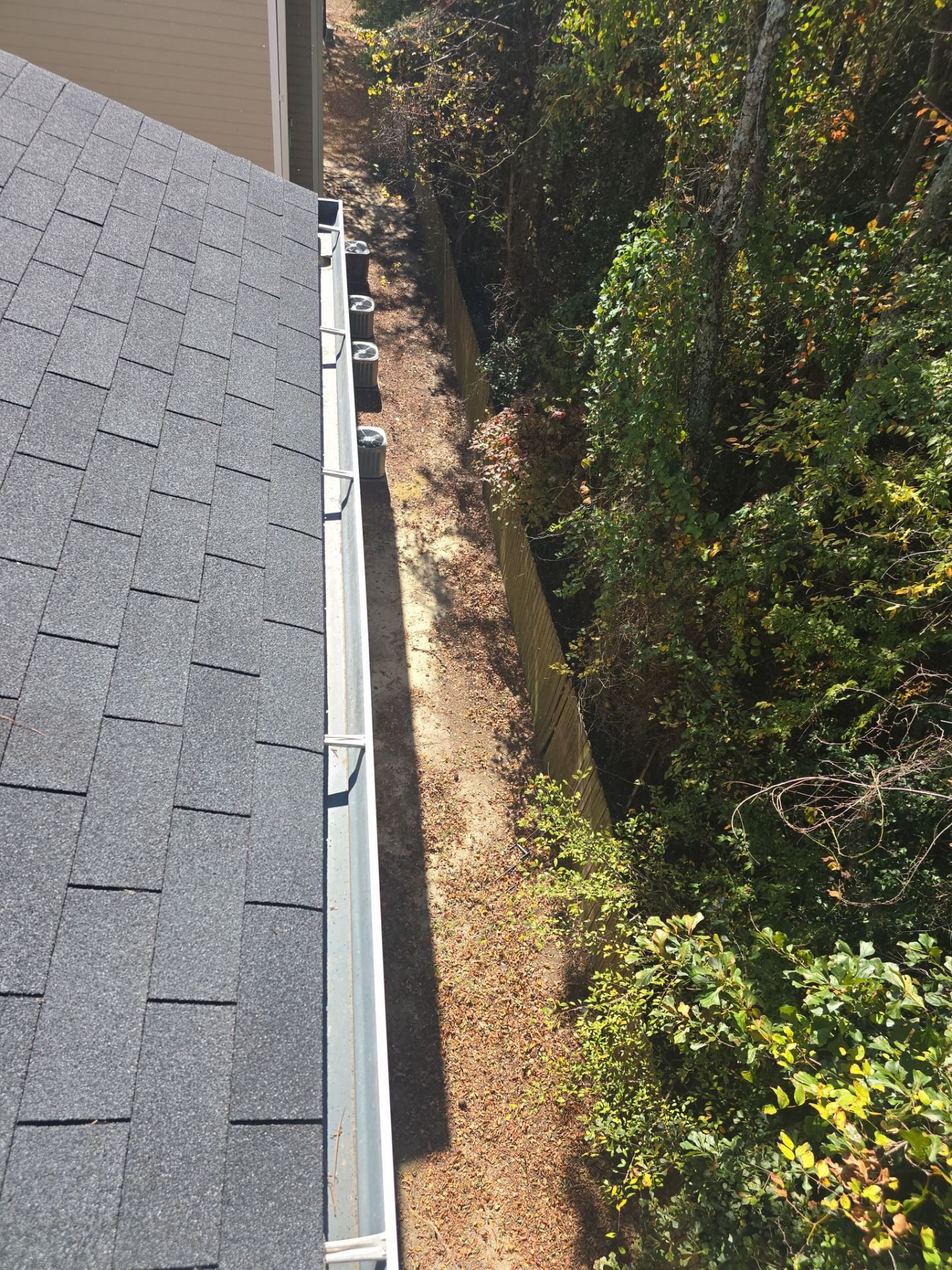 HOA gutter cleaning in Pinehurst & Southern Pines, NC, after  photo showing full gutters.