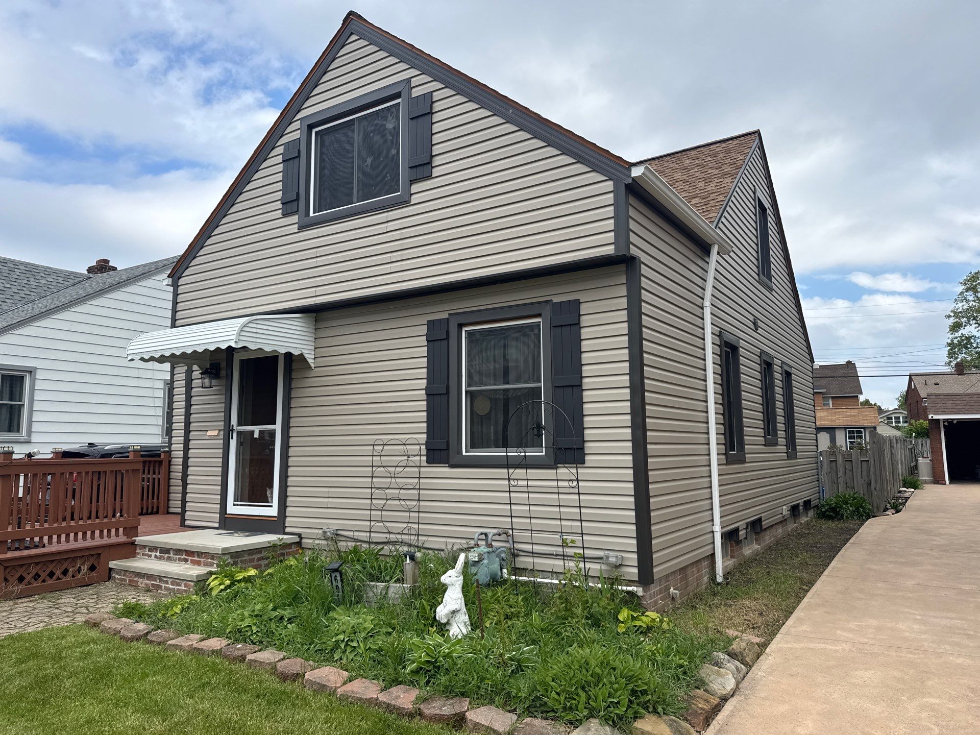 Full Exterior Siding and Awning Transformation in Parma by Cornerstone Roofing And Siding
