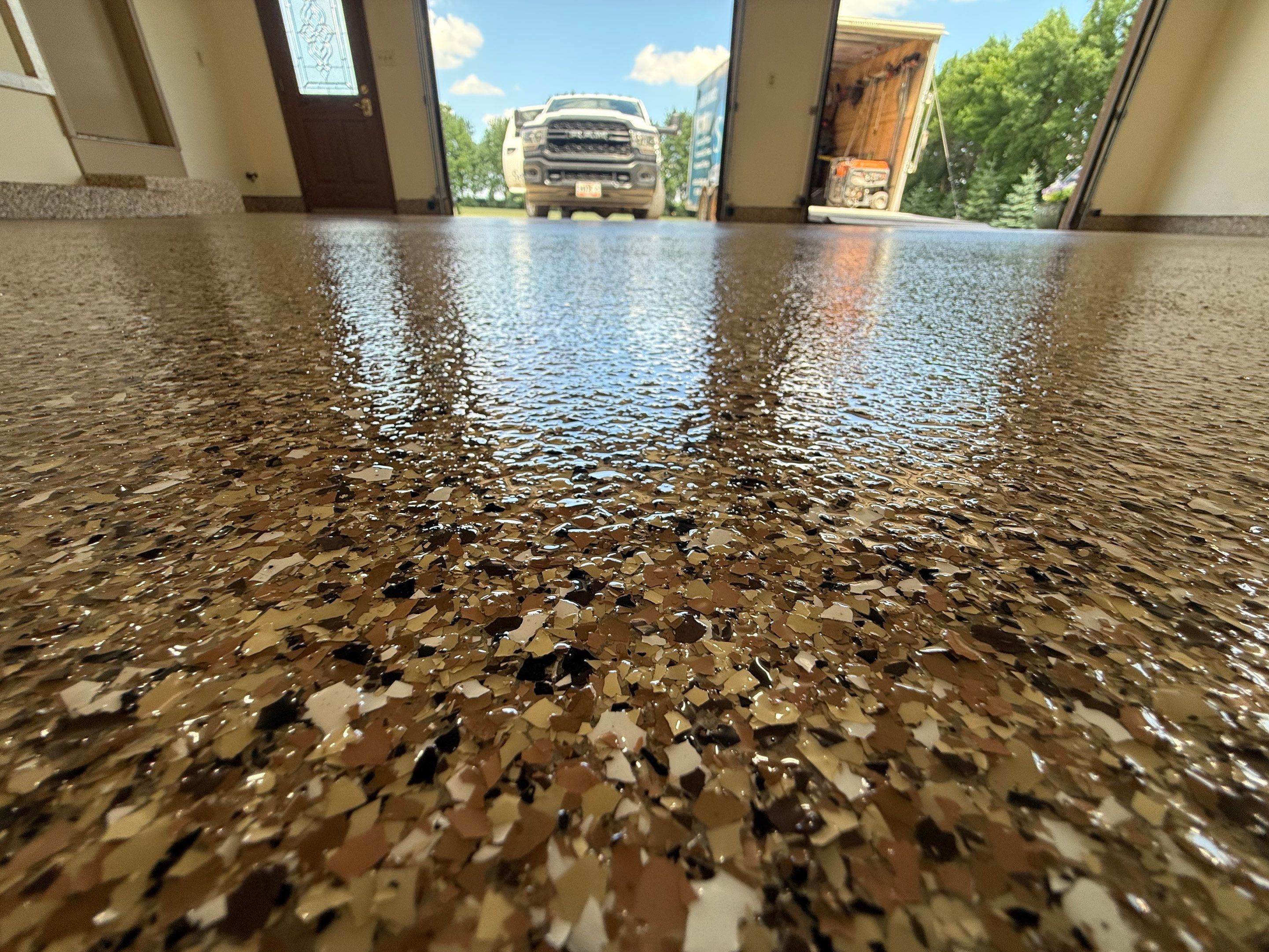 Custom Polyaspartic Garage Floor and Stairwell Coating in Pipestone by Select Painting, Coatings & Garage Cabinets