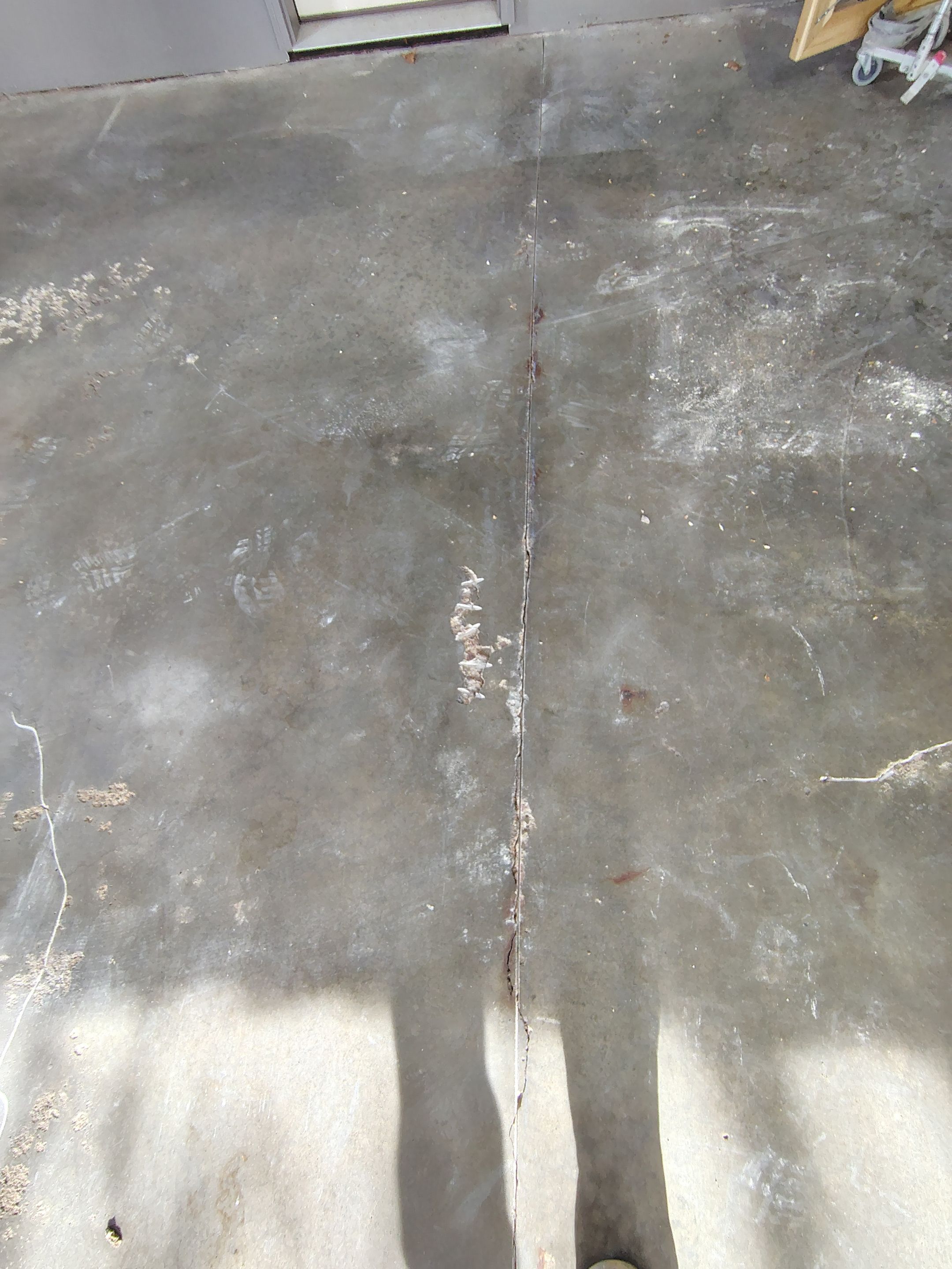 Garage Floor Concrete Coating and Crack Repair in Sioux Falls by Select Painting, Coatings & Garage Cabinets