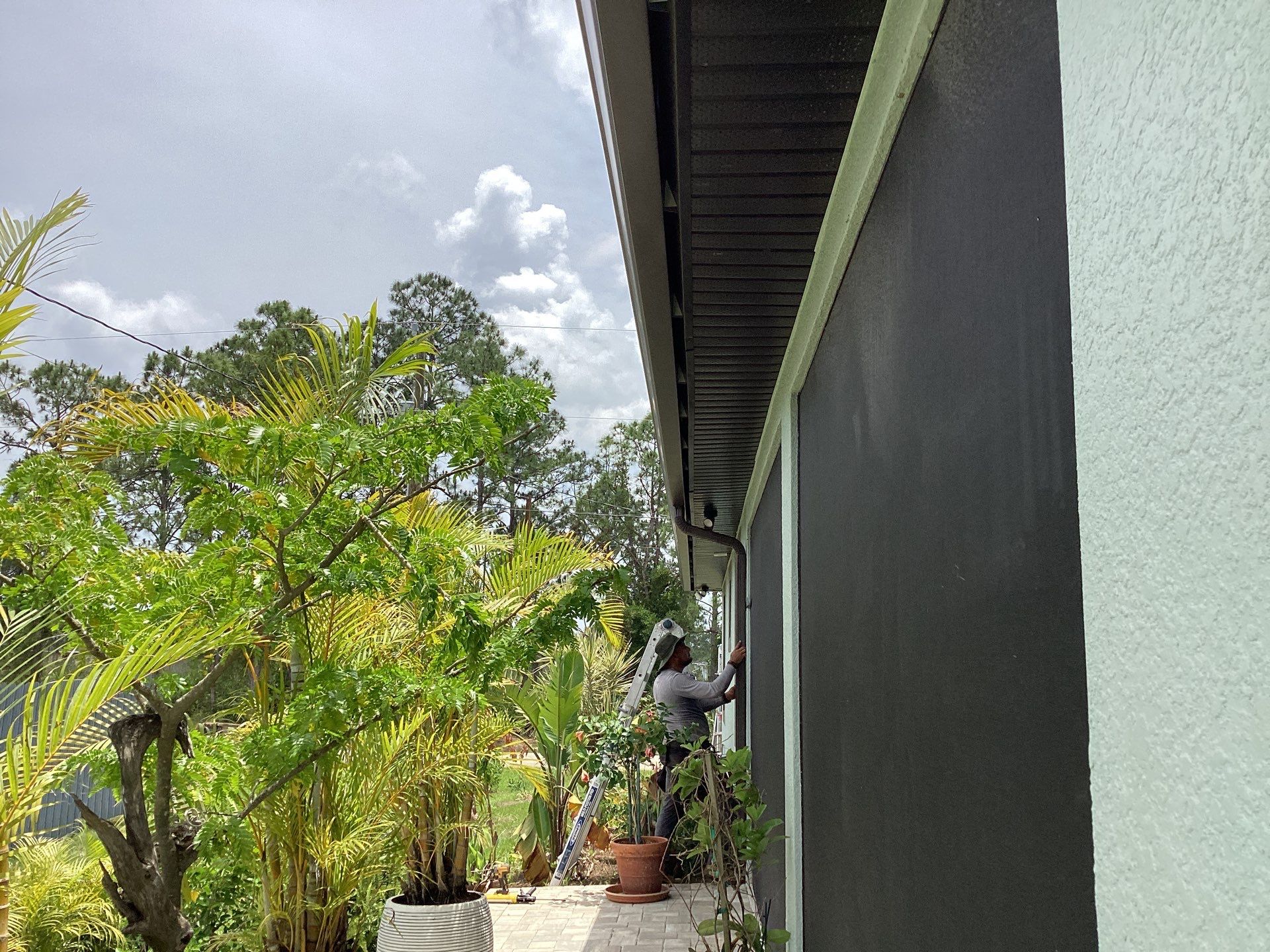 Musket Brown and New Downspouts in Lehigh Acres, FL  by Gutter Professors