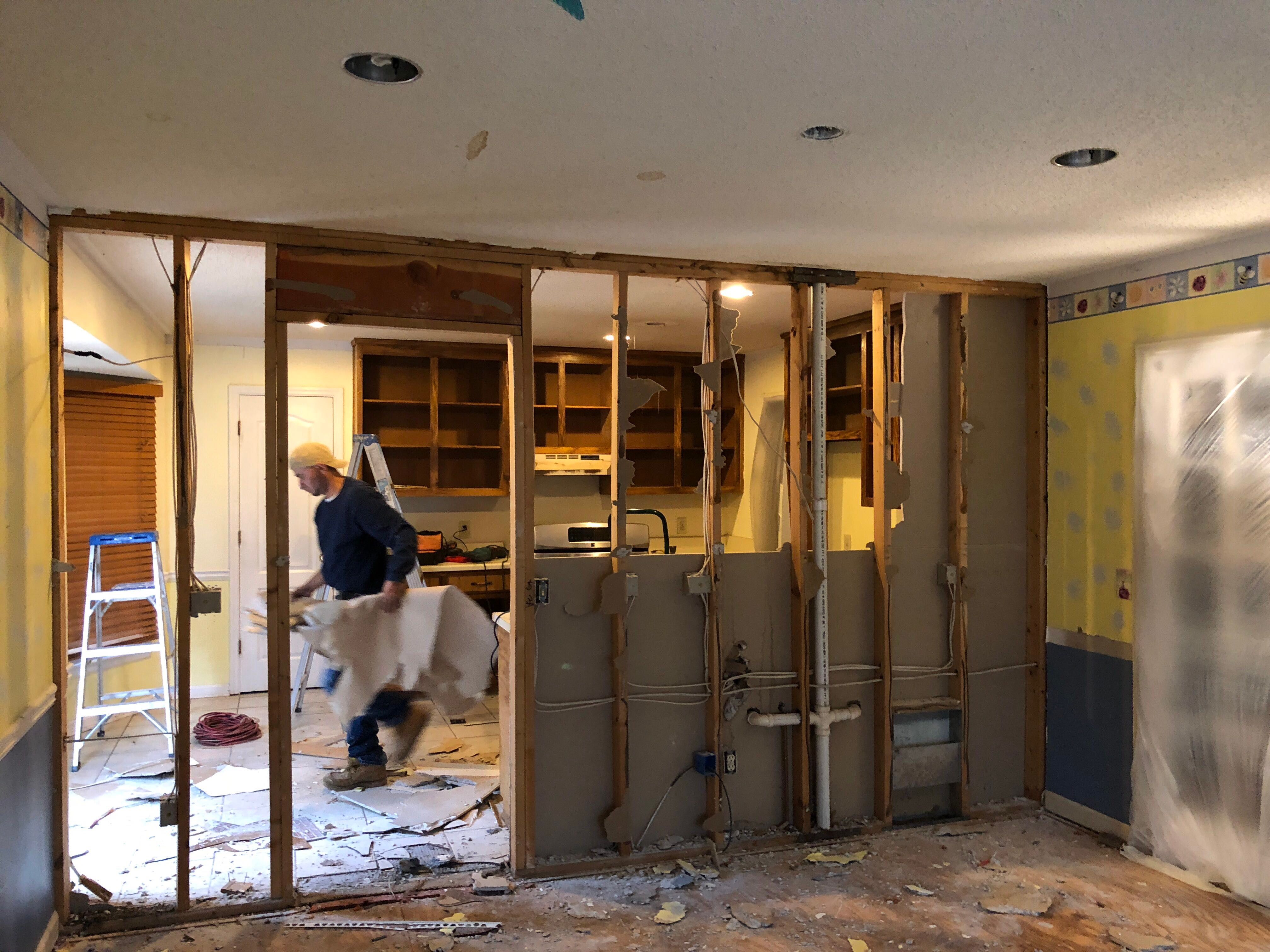 Open Concept Kitchen Remodel With White Shaker Cabinets in Kennesaw by Swift Home Renovations