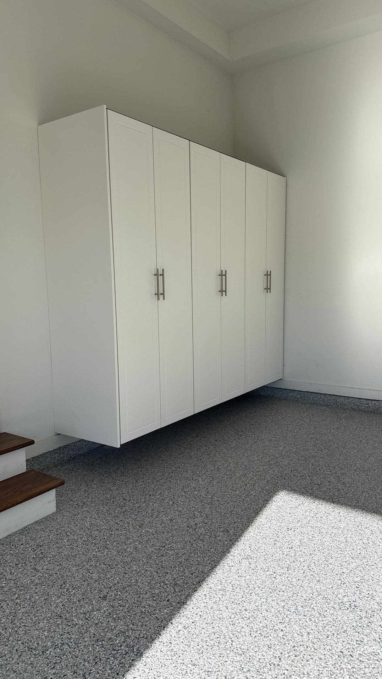Garage Remodel with Custom Cabinets and Epoxy Floors in Overland Park by Banner Garage