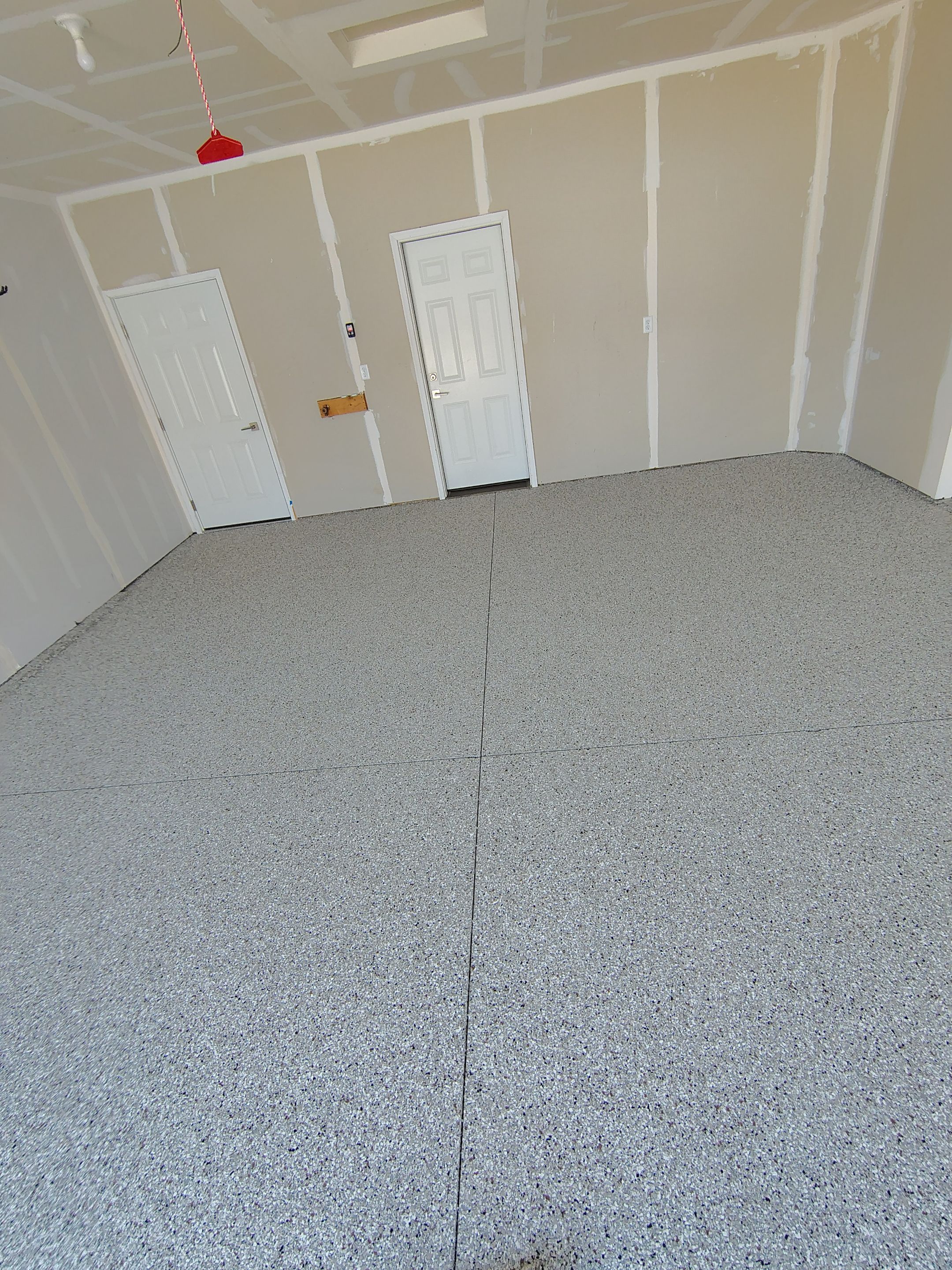 Custom Epoxy Garage Floor and Patio Coating in Sioux Falls by Select Painting, Coatings & Garage Cabinets
