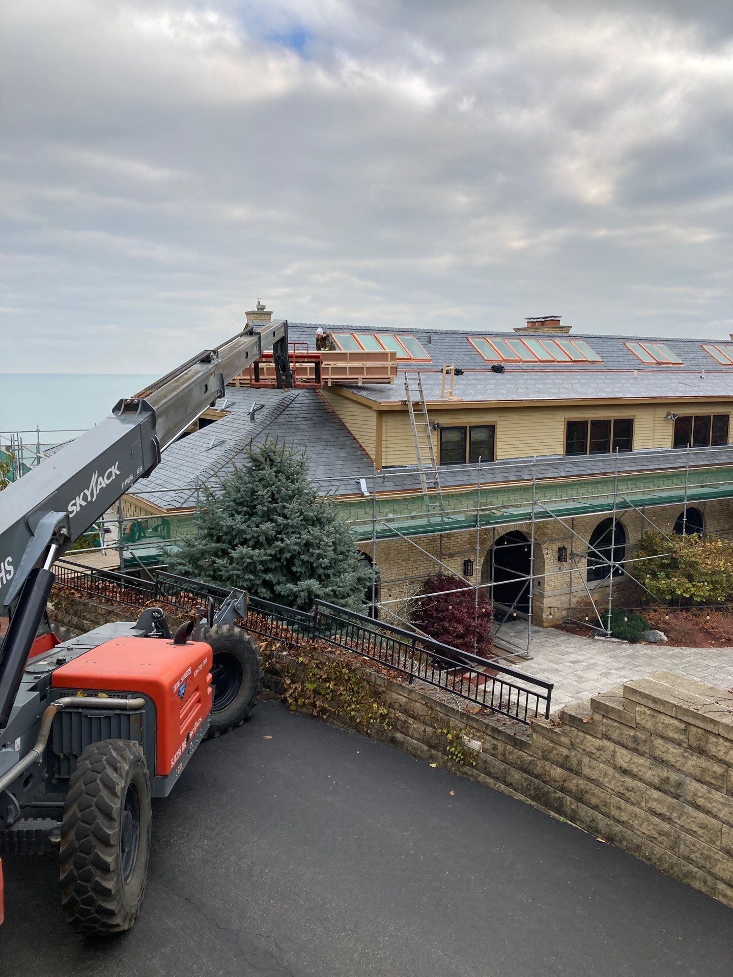 Slate Roof Replacement and Half Round Copper Gutter Installation by Custom Installations