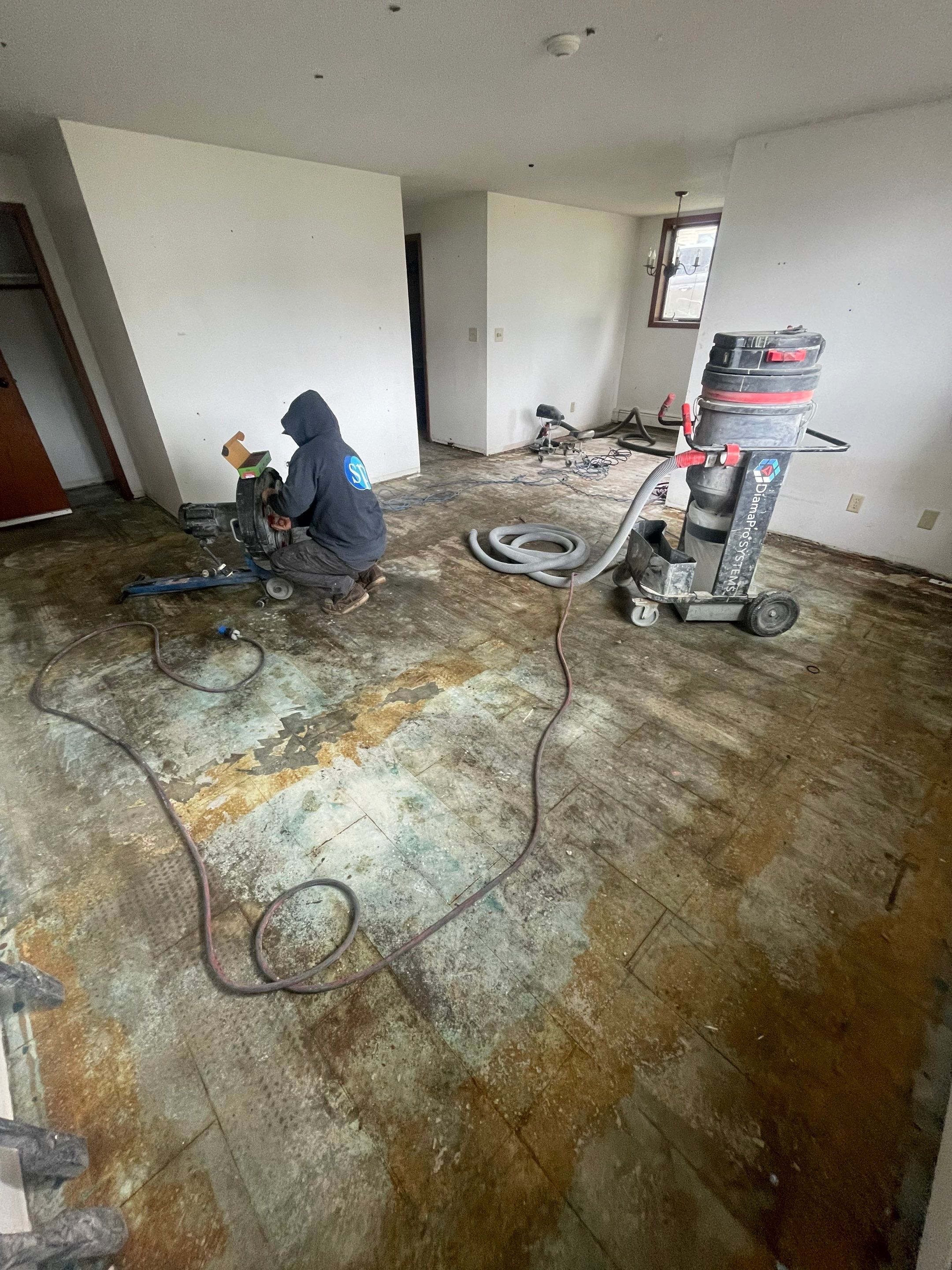 Commercial Subfloor Preparation and Flooring Restoration in Sioux Falls by Select Painting, Coatings & Garage Cabinets