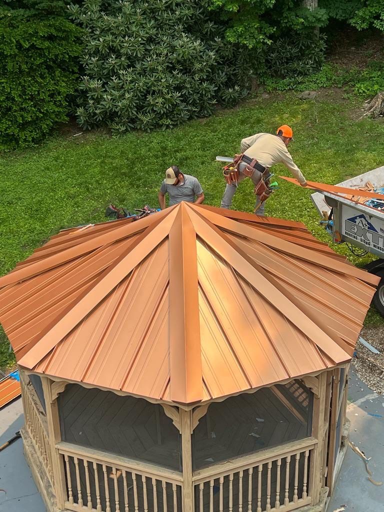 Residential Roofing Installation using Copper Penny Metal Roof by A Plus Exterior