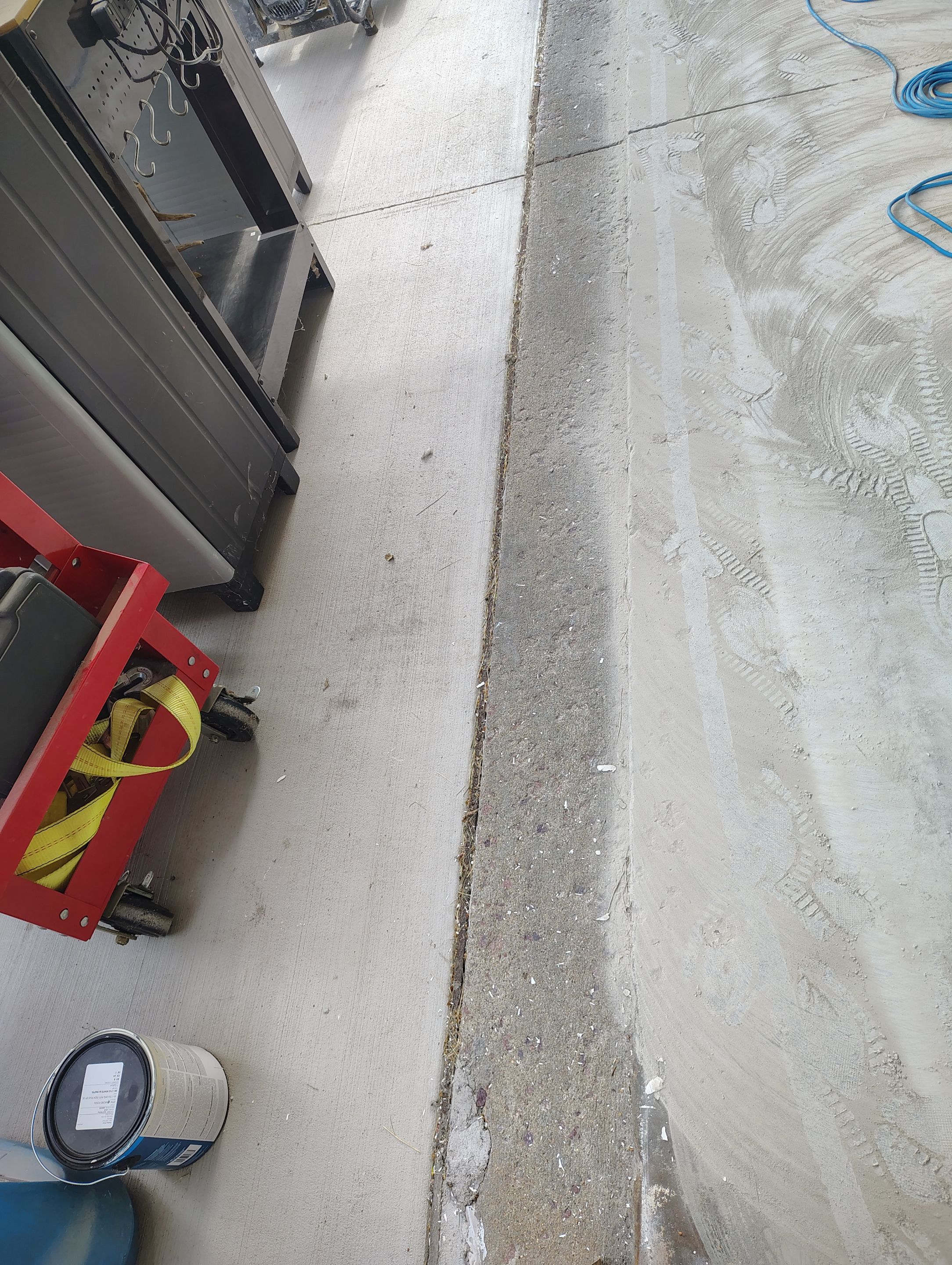 Custom Grey Speckled Epoxy Floor Coating for Sioux Falls Garage by Select Painting, Coatings & Garage Cabinets
