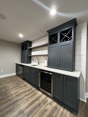 Modern Basement Remodeling in Woodstock with Custom Live-Edge Bar