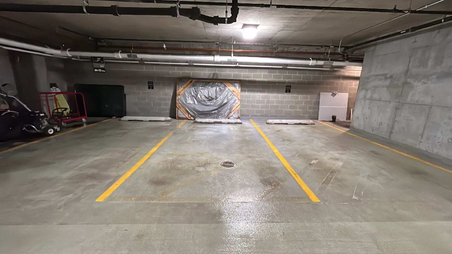 Parking garage using Hot water by Northern Power Washing LLC.