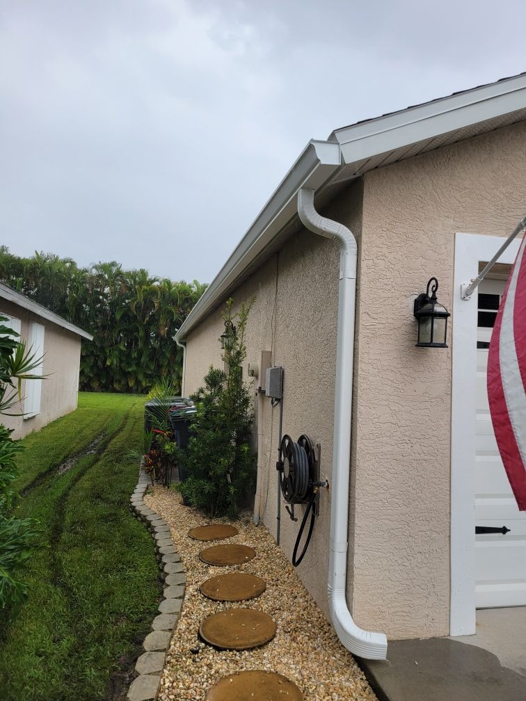 White Aluminum Seamless Gutters and Downspouts in Estero FL by Gutter Professors