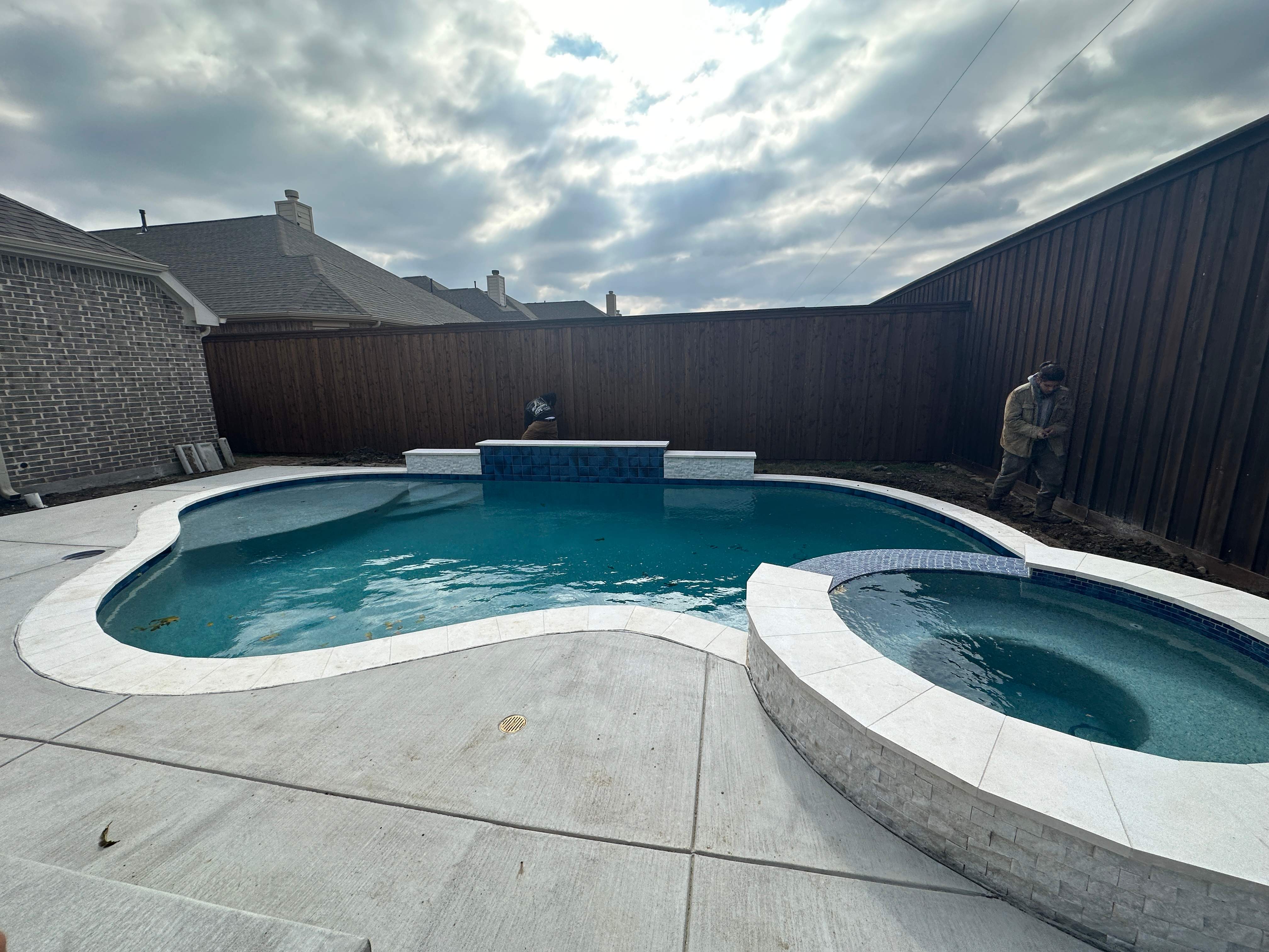 Freeform Pool with Rock Waterfall and Raised Spa by Pinnacle Pools and Spas - DFW