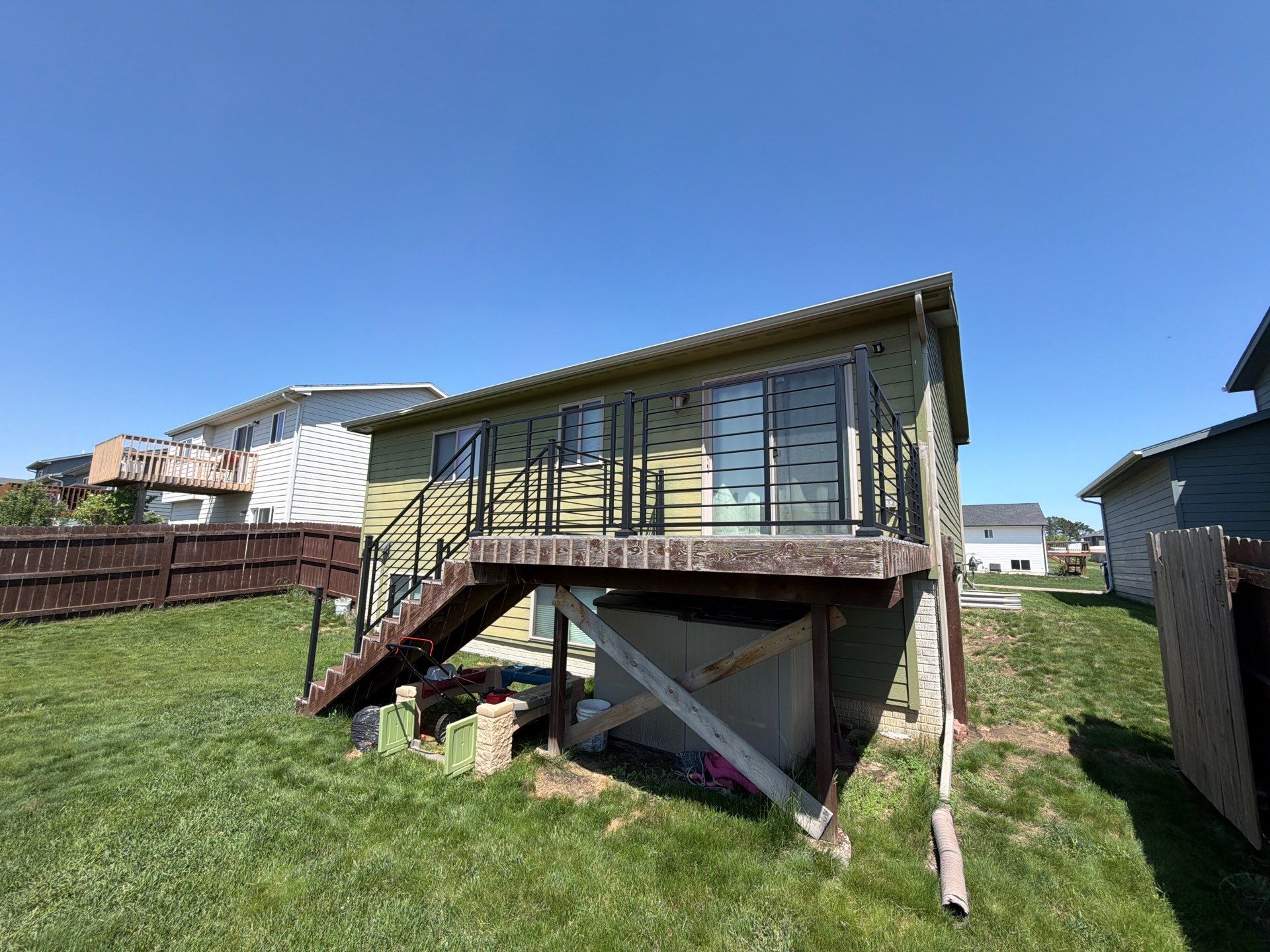 Exterior Painting and Custom Deck Construction in Sioux Falls by Select Painting, Coatings & Garage Cabinets