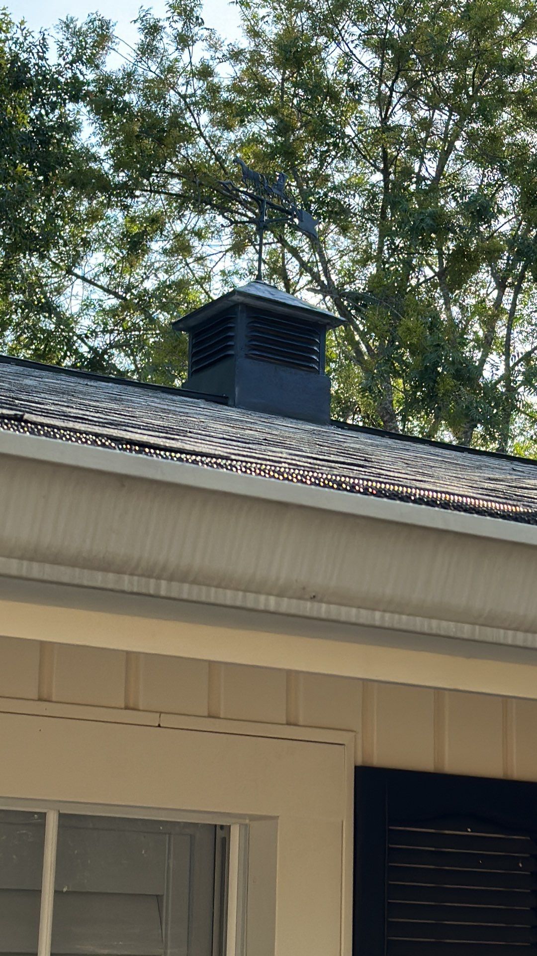 White siding/white brick chimney with Malarkey Silverwood by Tejas Roofworks + Restoration