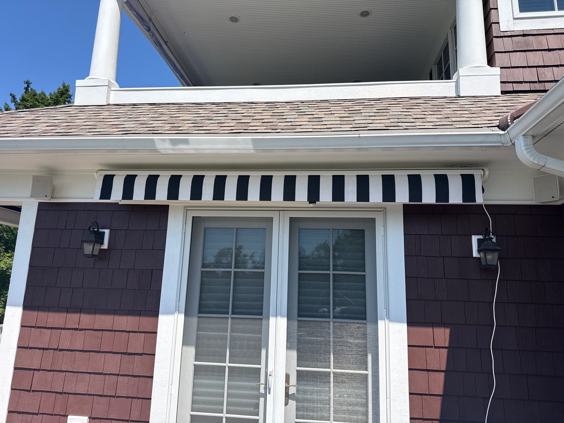Sunesta Retractable Awning Installation in Harbor Springs by Rainbow Seamless Systems