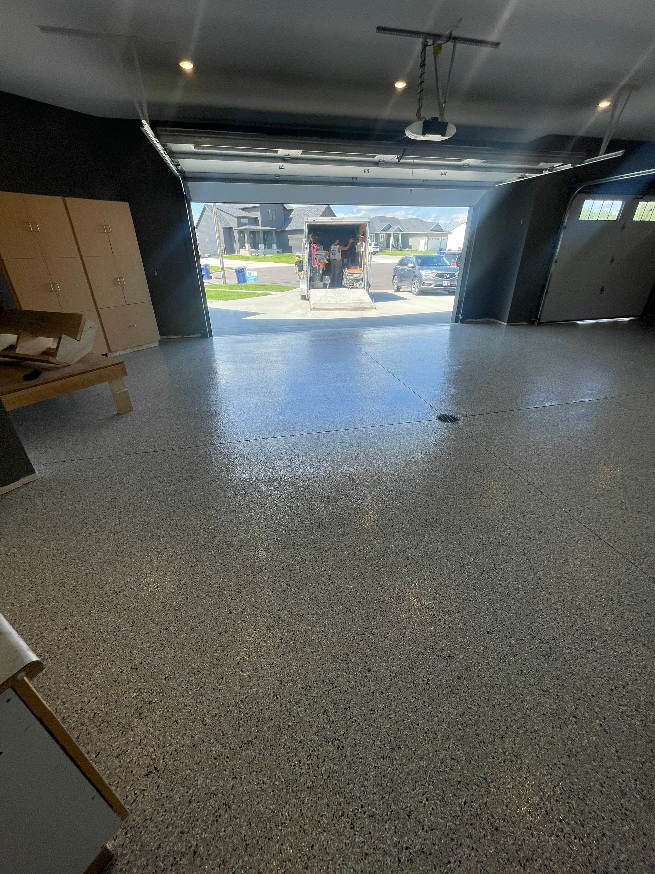 Custom Speckled Concrete Coating for Dell Rapids Garage by Select Painting, Coatings & Garage Cabinets