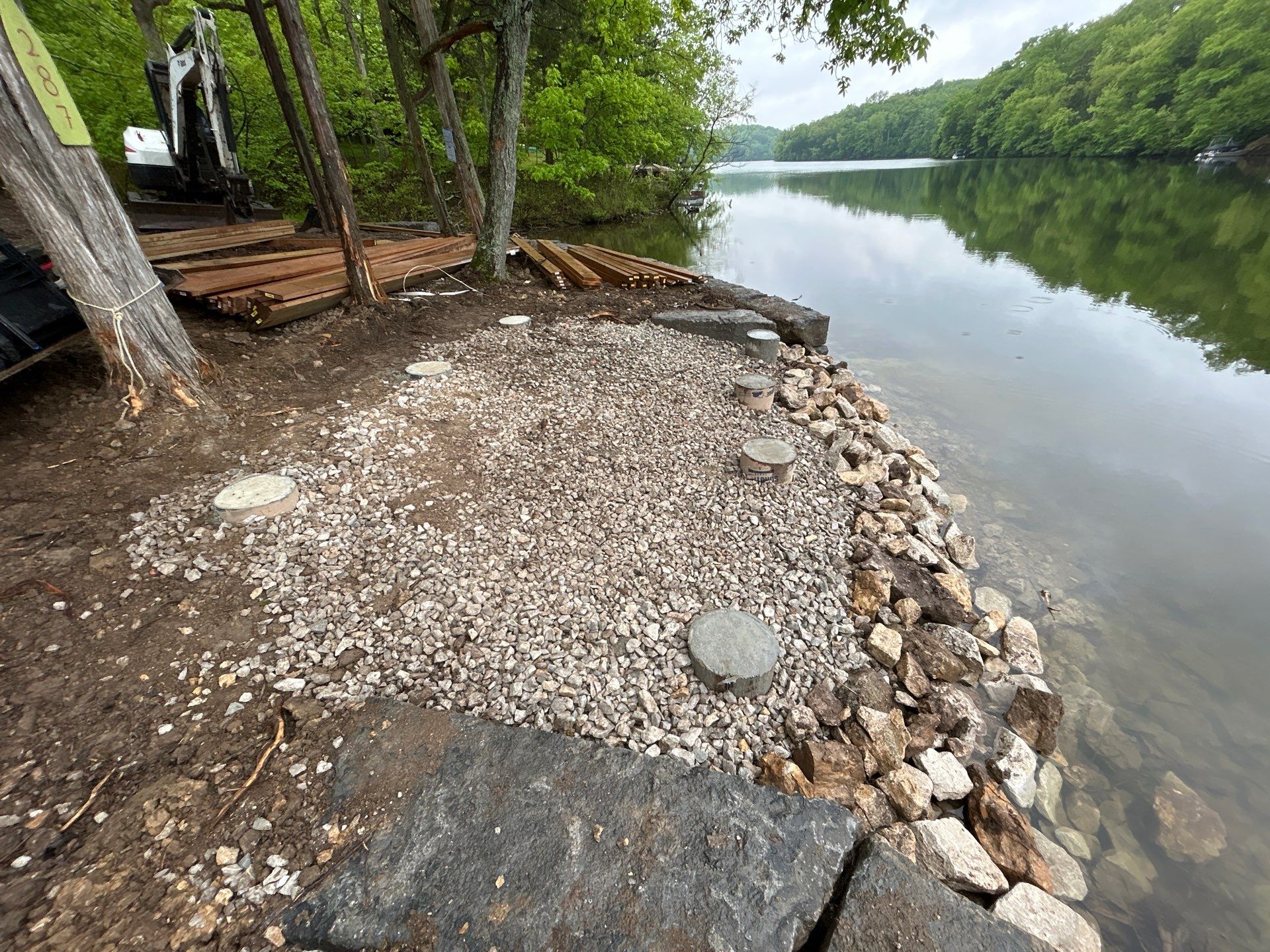 Lakeside Deck & Fire Pit by Loch Ness Landscaping, LLC
