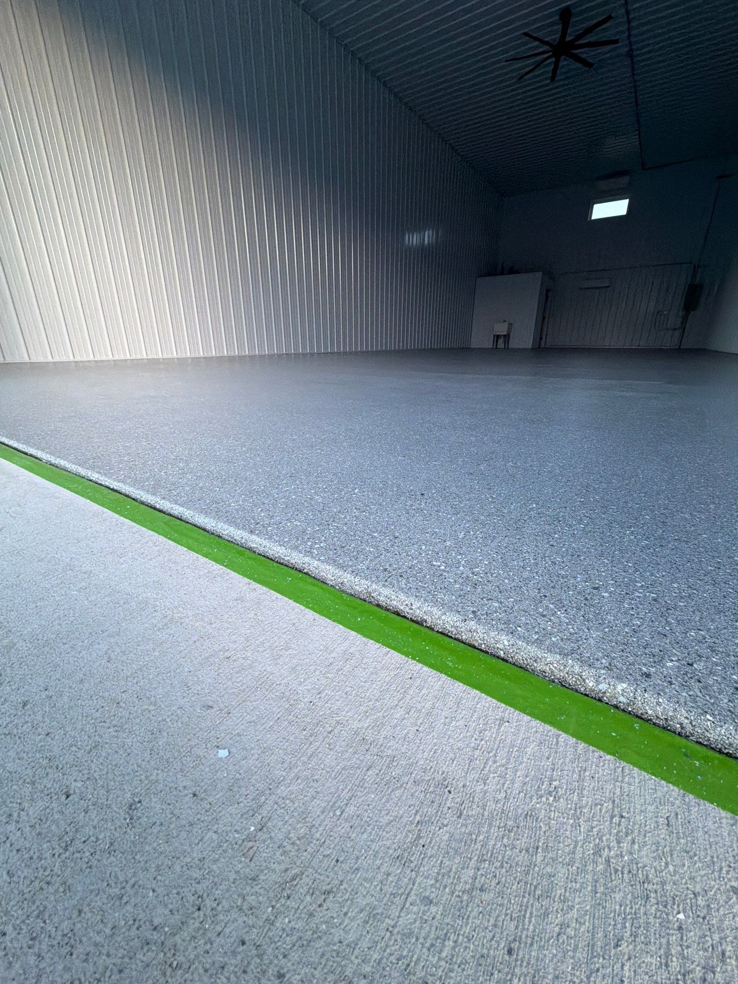 Commercial Storage Bay Epoxy Flake Floor Installation in North Muskegon by Gordon Painting