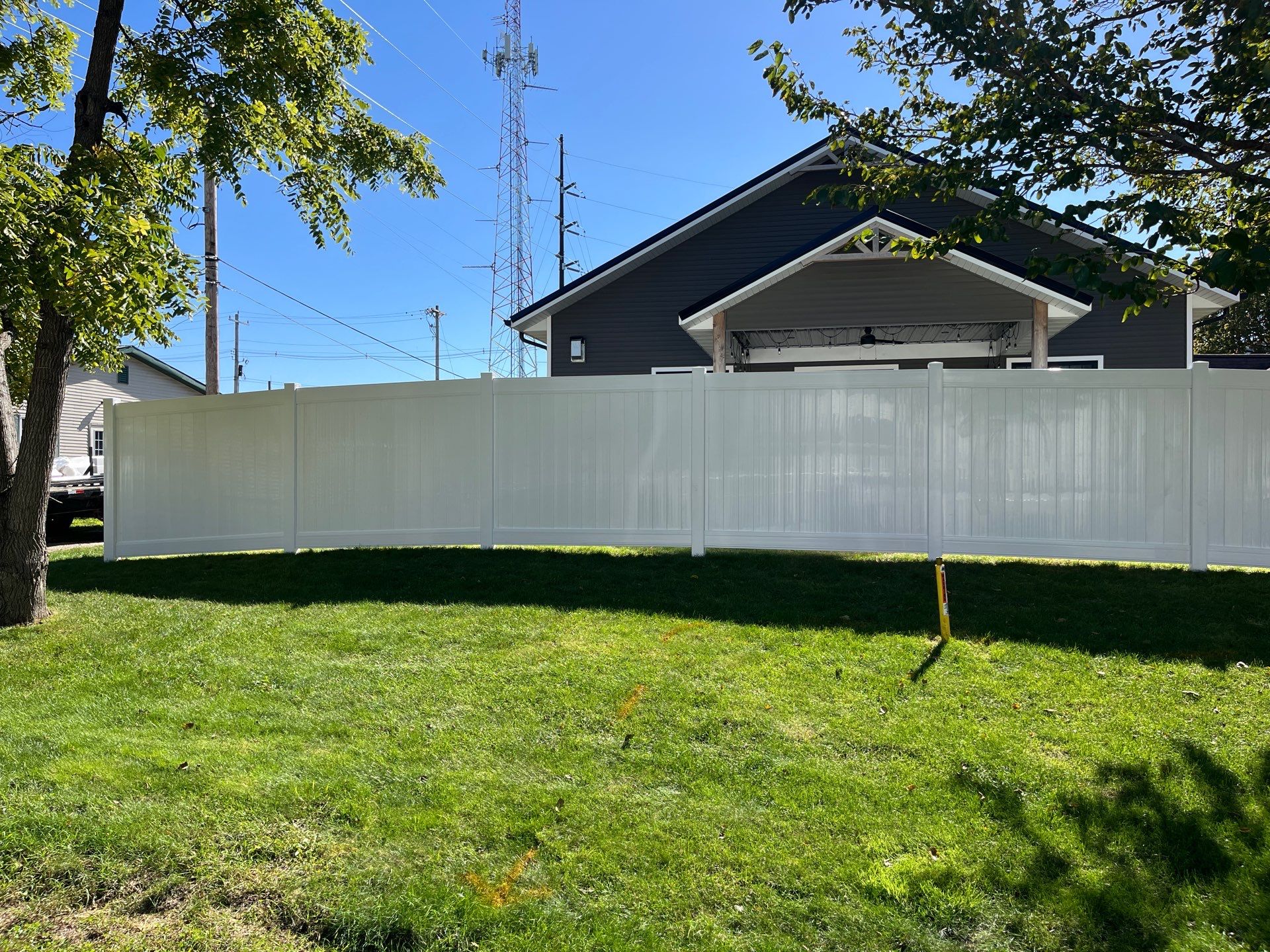 White Vinyl Privacy Fence Installation in Grundy Center by Perfect Picket Fence and Stain