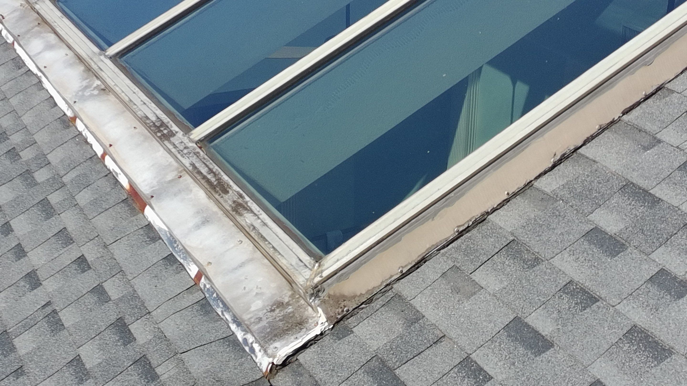 Ridge Skylight Repair and Shingle Roof Maintenance in Winter Park by Fortified Roofing Solutions Corp.