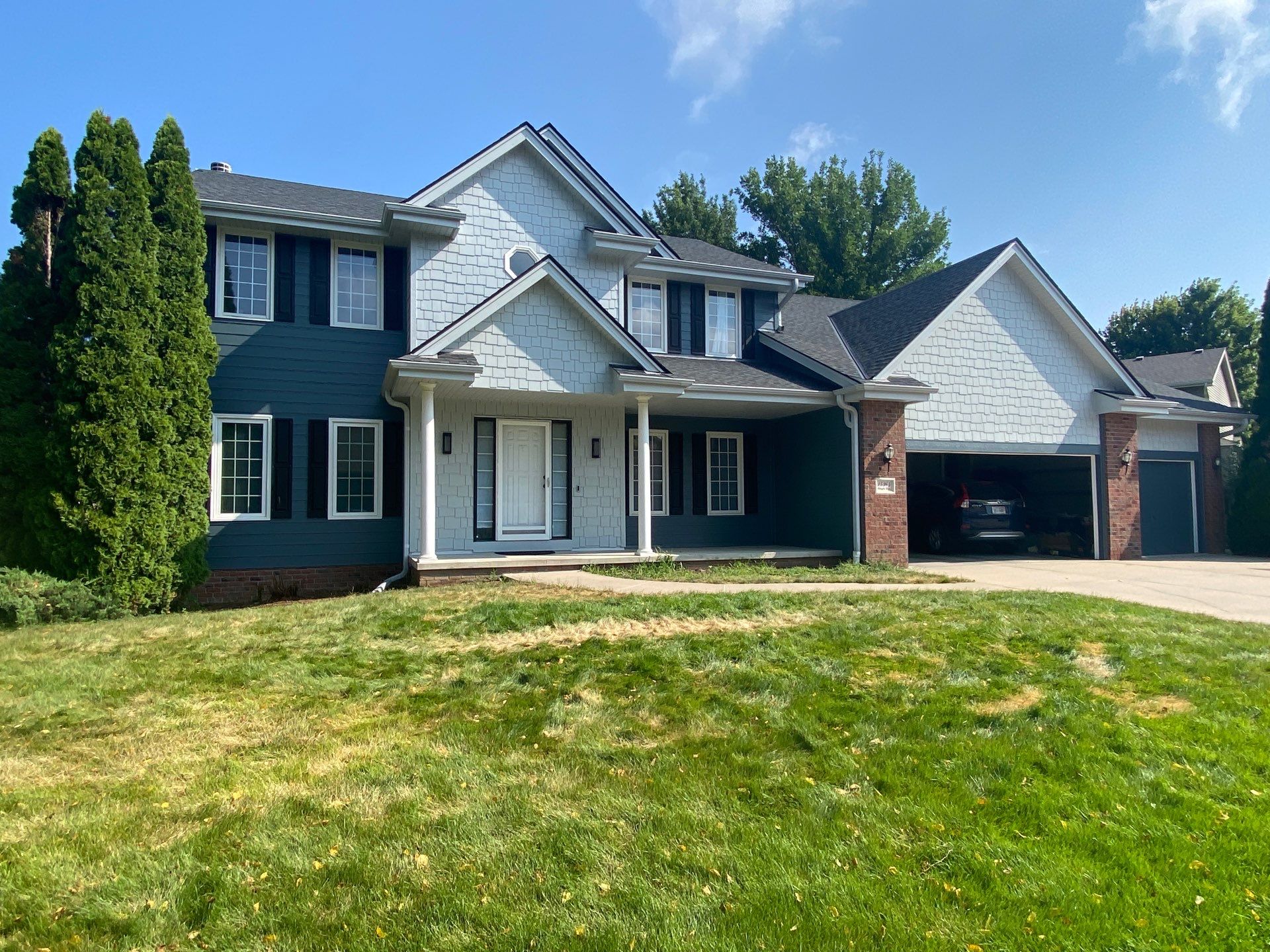 James Hardie Siding Transformation in Omaha with Evening Blue by Carps Complete Exteriors 