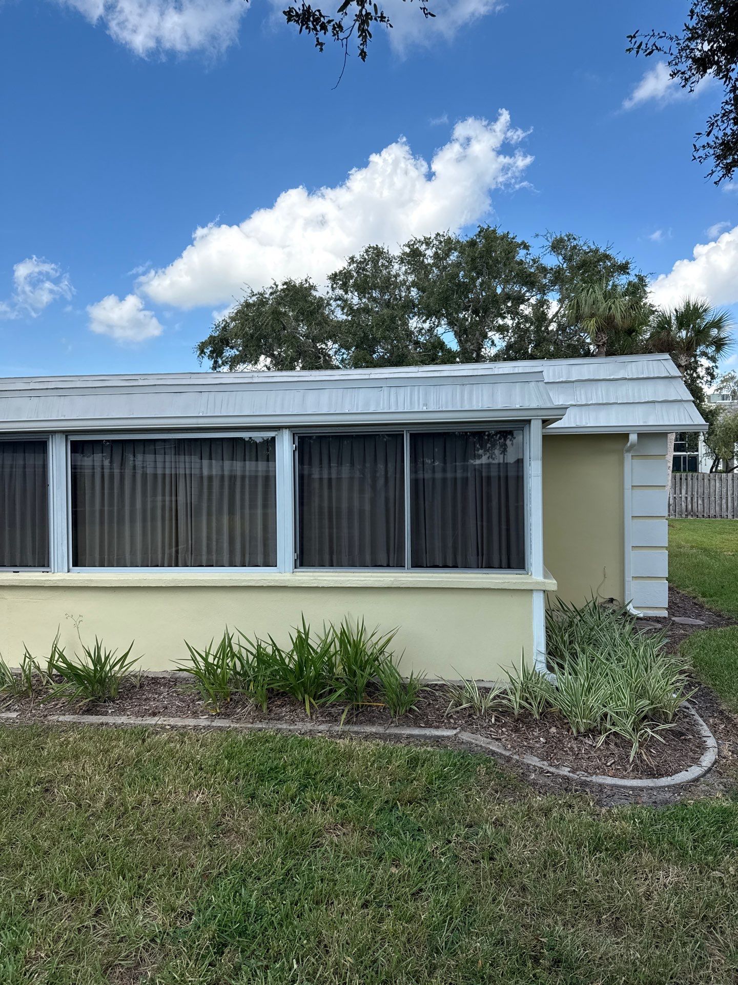 White Gutters and Matching Downspouts in Sarasota FL by Gutter Professors