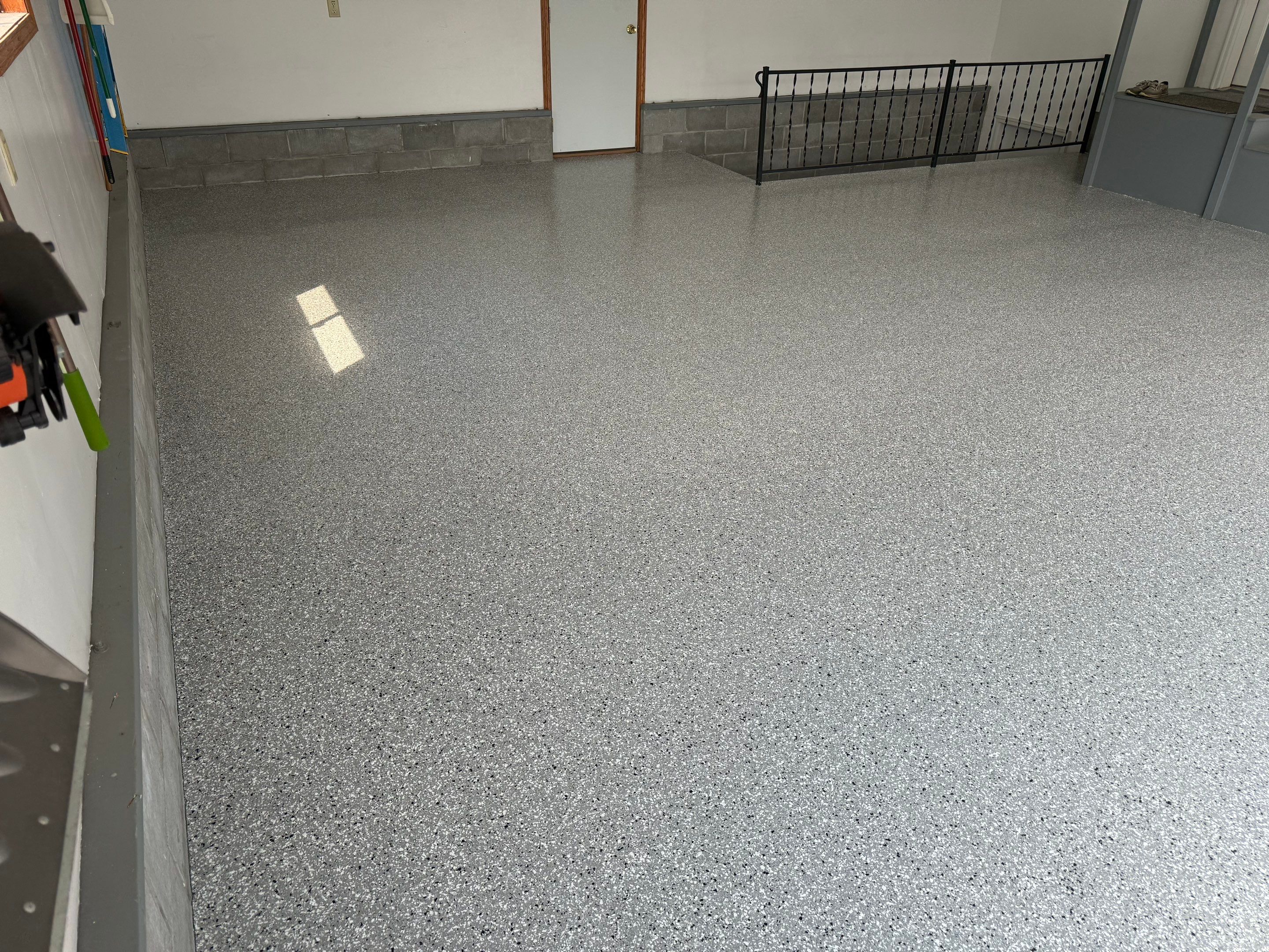 Feather Grey Garage Floor Coating and Concrete Restoration in Mitchell by Select Painting, Coatings & Garage Cabinets
