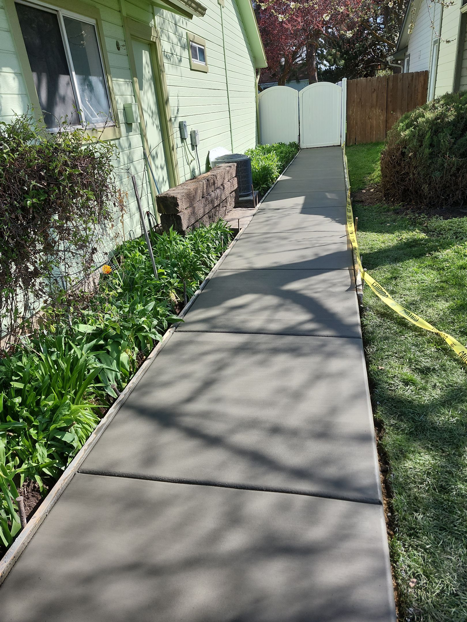Gravel Walkway into Gorgeous New Concrete by Mr. Mudd Concrete