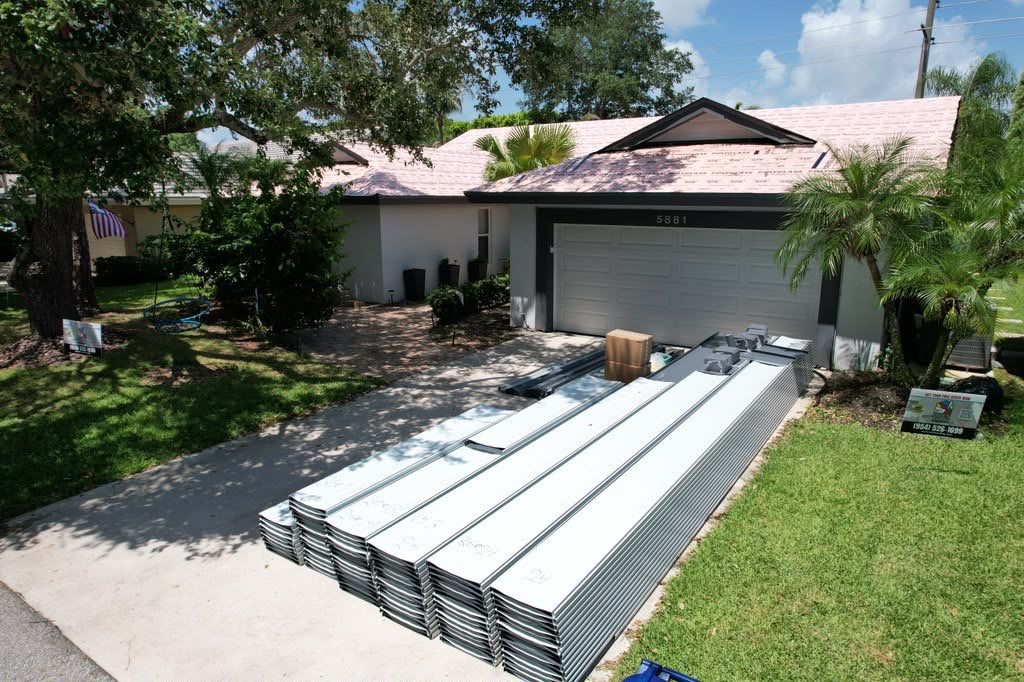 Standing Seam Metal Charcoal Grey Roof Replacement and Skylight Installation in Jupiter by Art's Roofing & Construction