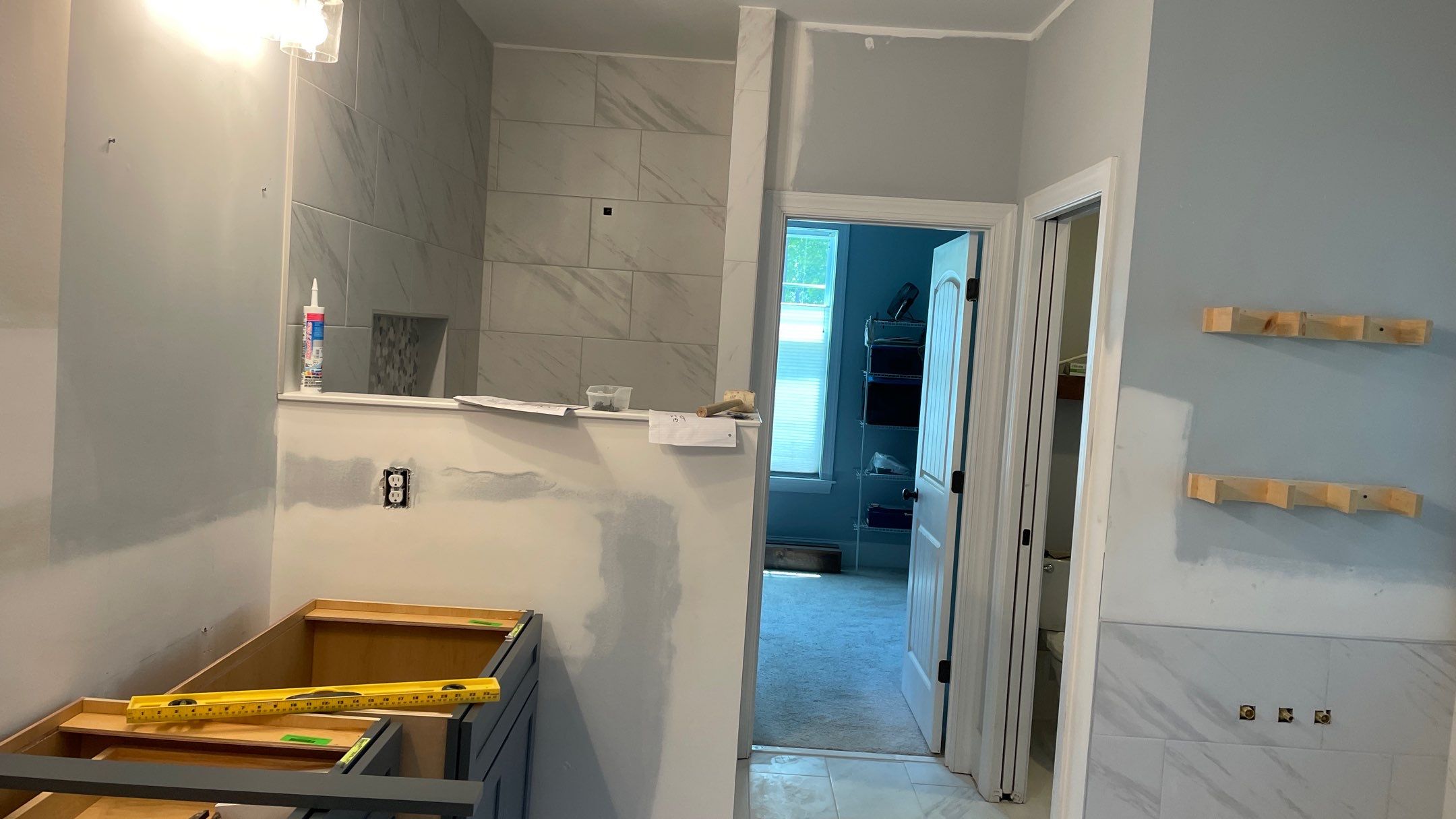 Bright Bathroom Remodel with Wall Removal, Stand Alone Tub and New Vanity by Footprints Floors of Coastal Carolina