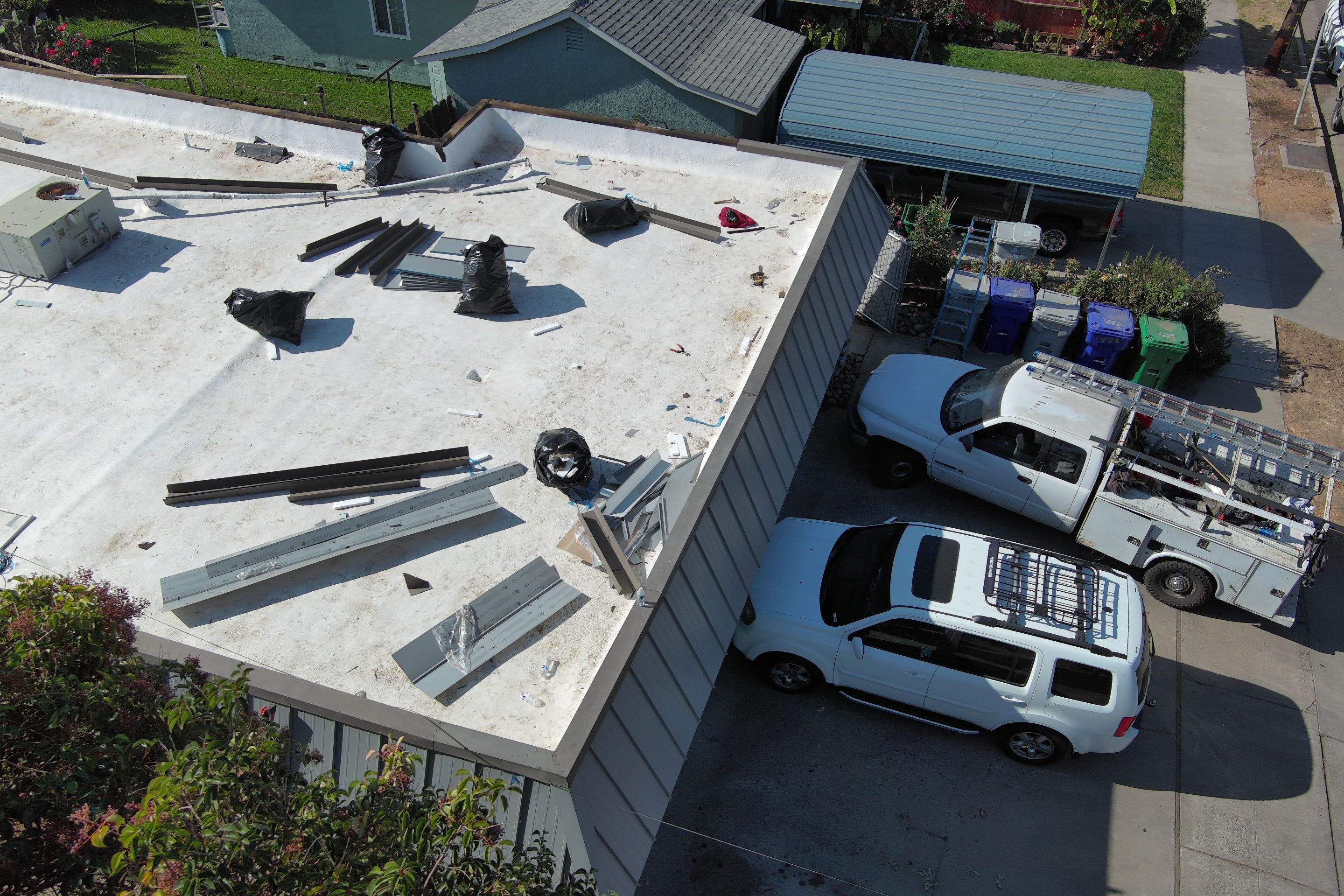 Foam Refurbish using Conklin Benchmark/PUMA XL coatings and spray foam; Also metal roofing around parapet wall by Straight Edge Roofing Inc