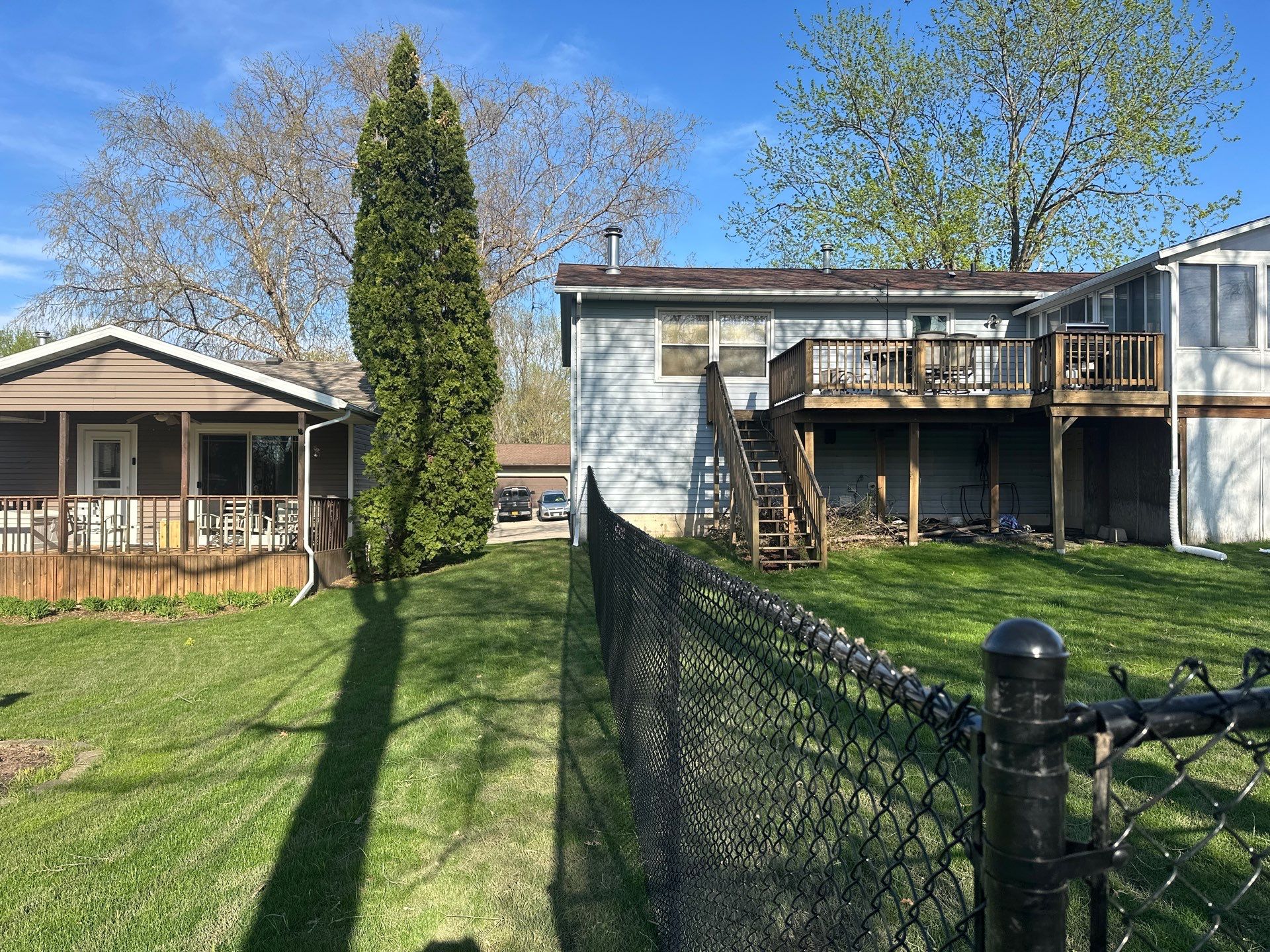 Black Vinyl-Coated Chain Link Fence Installation in Waterloo by Perfect Picket Fence and Stain