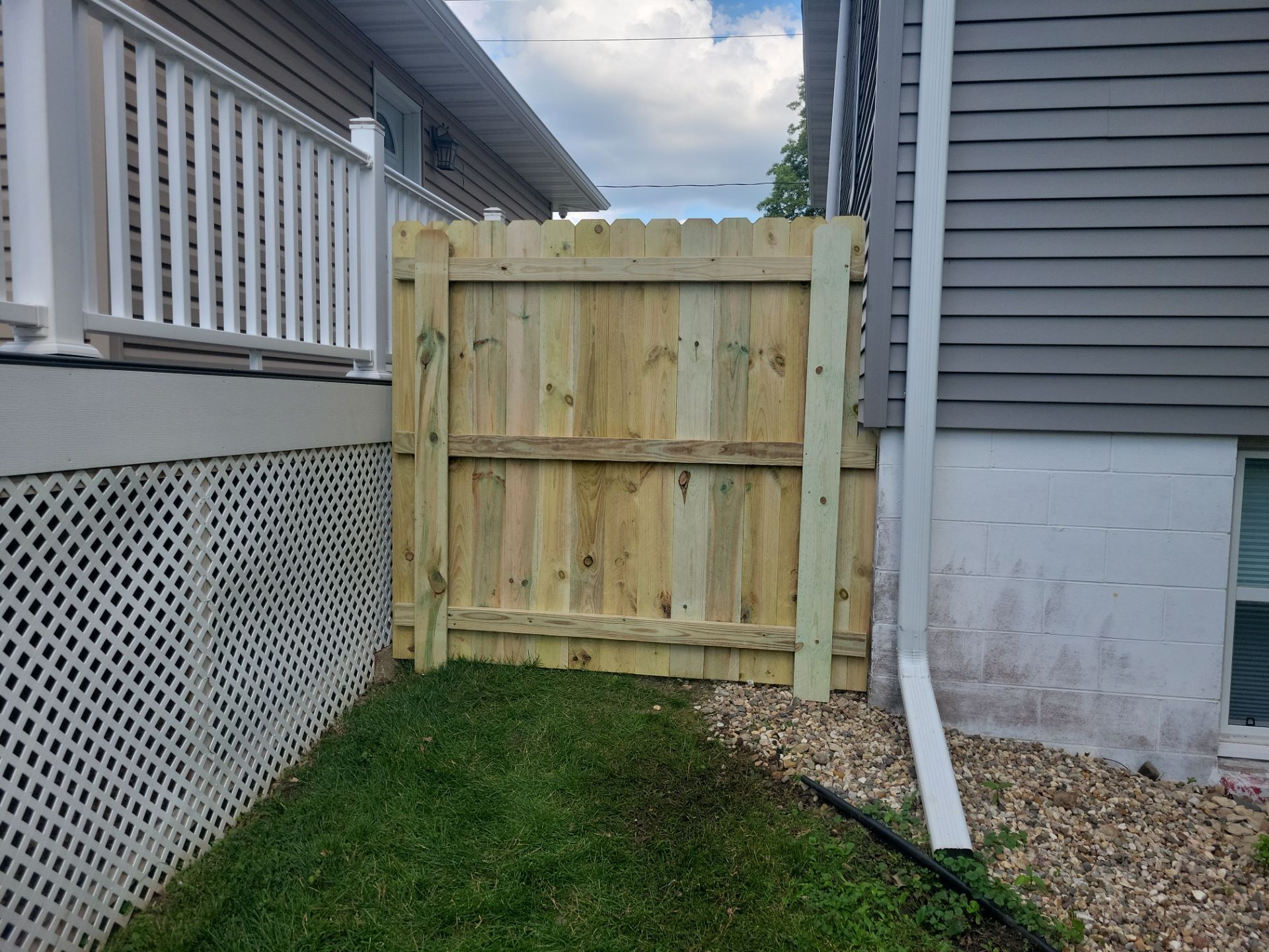 Pressure-Treated Pine Privacy Fence and Custom Gates in Waterloo by Perfect Picket Fence and Stain