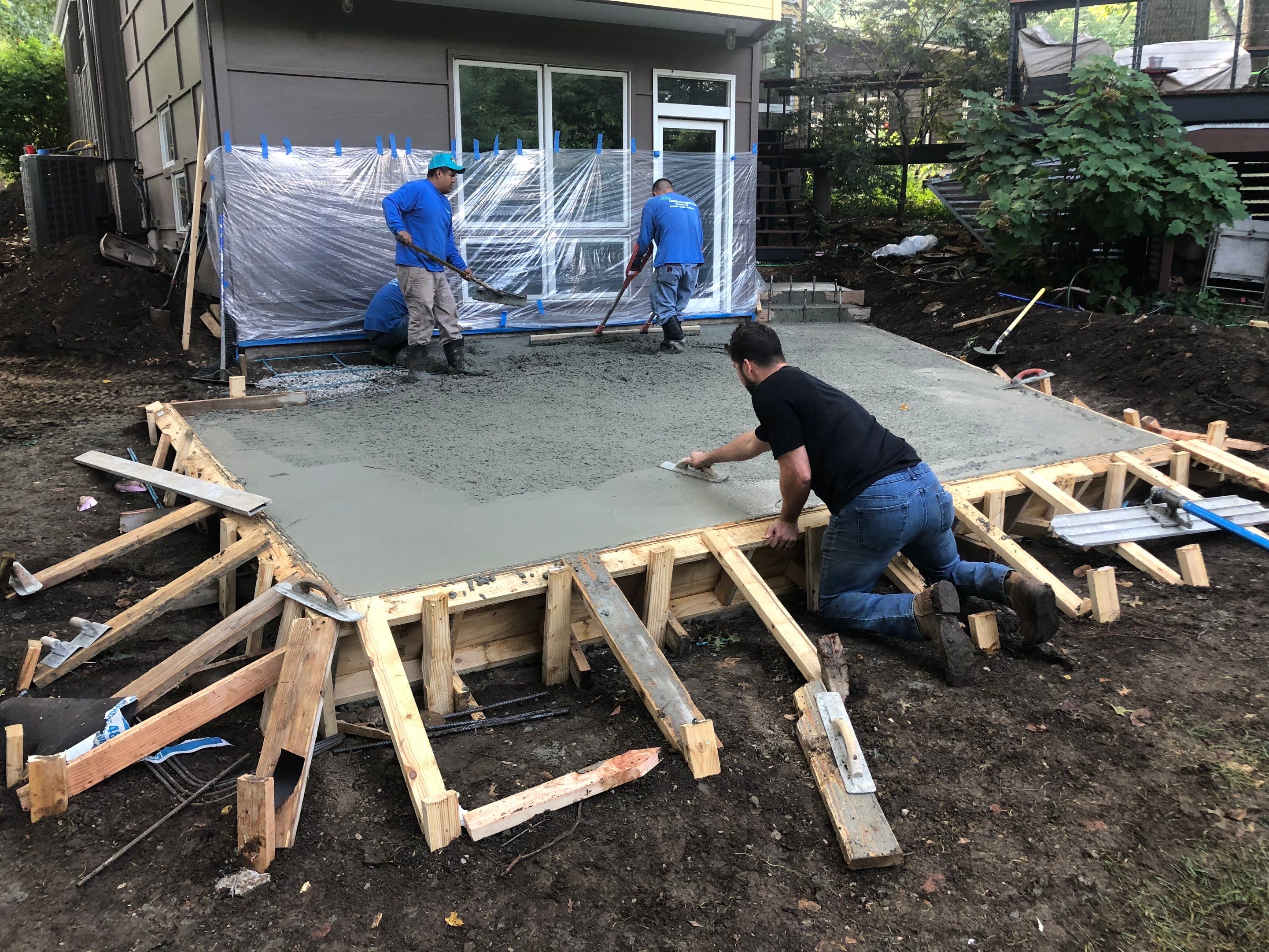 Back Yard Cantilivered Patio by LAND ESCAPES LLC
