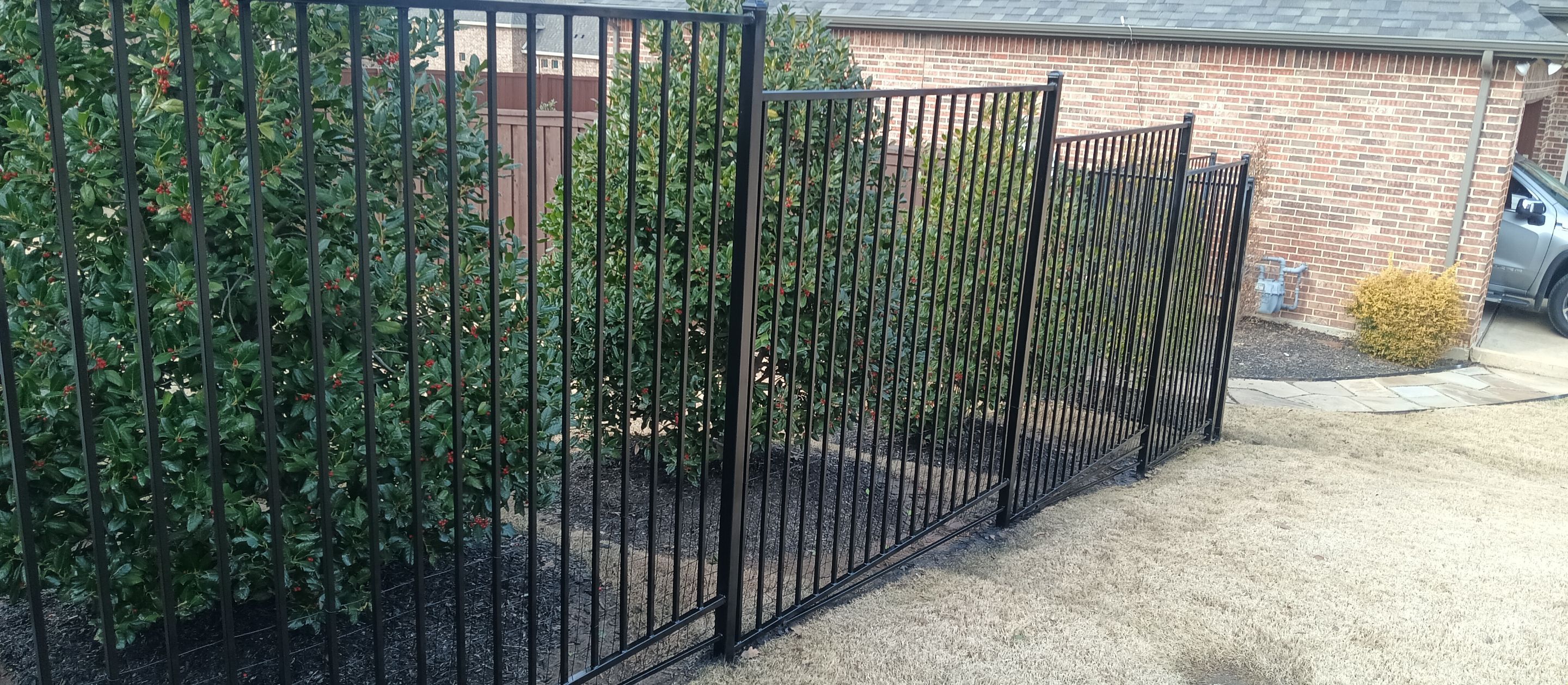 Wrought iron painting using DTM gloss black enamel by Grizzly Fence And Patio