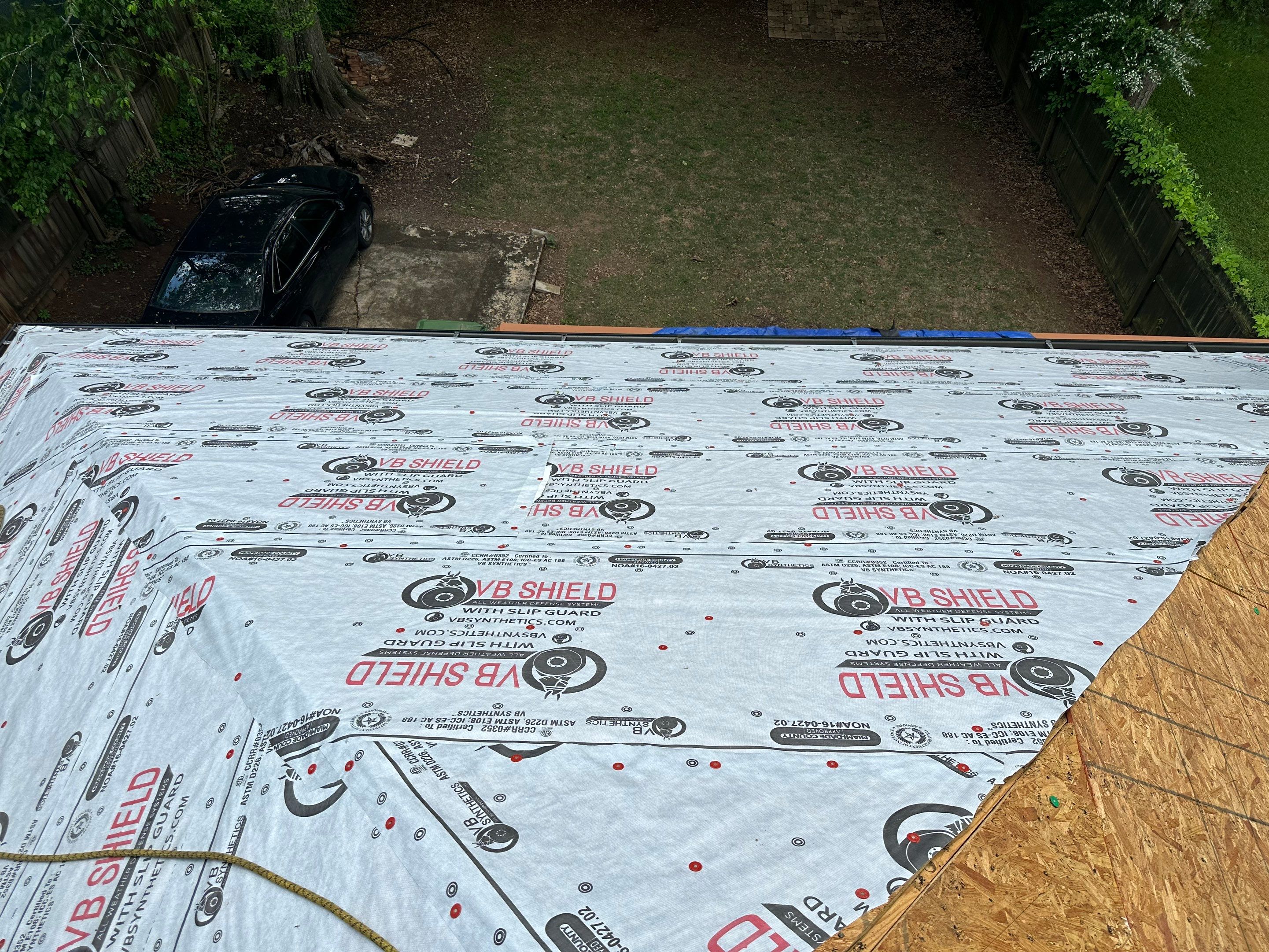 roof replacement and new black gutters by Nailed It Roofing & Remodeling LLC